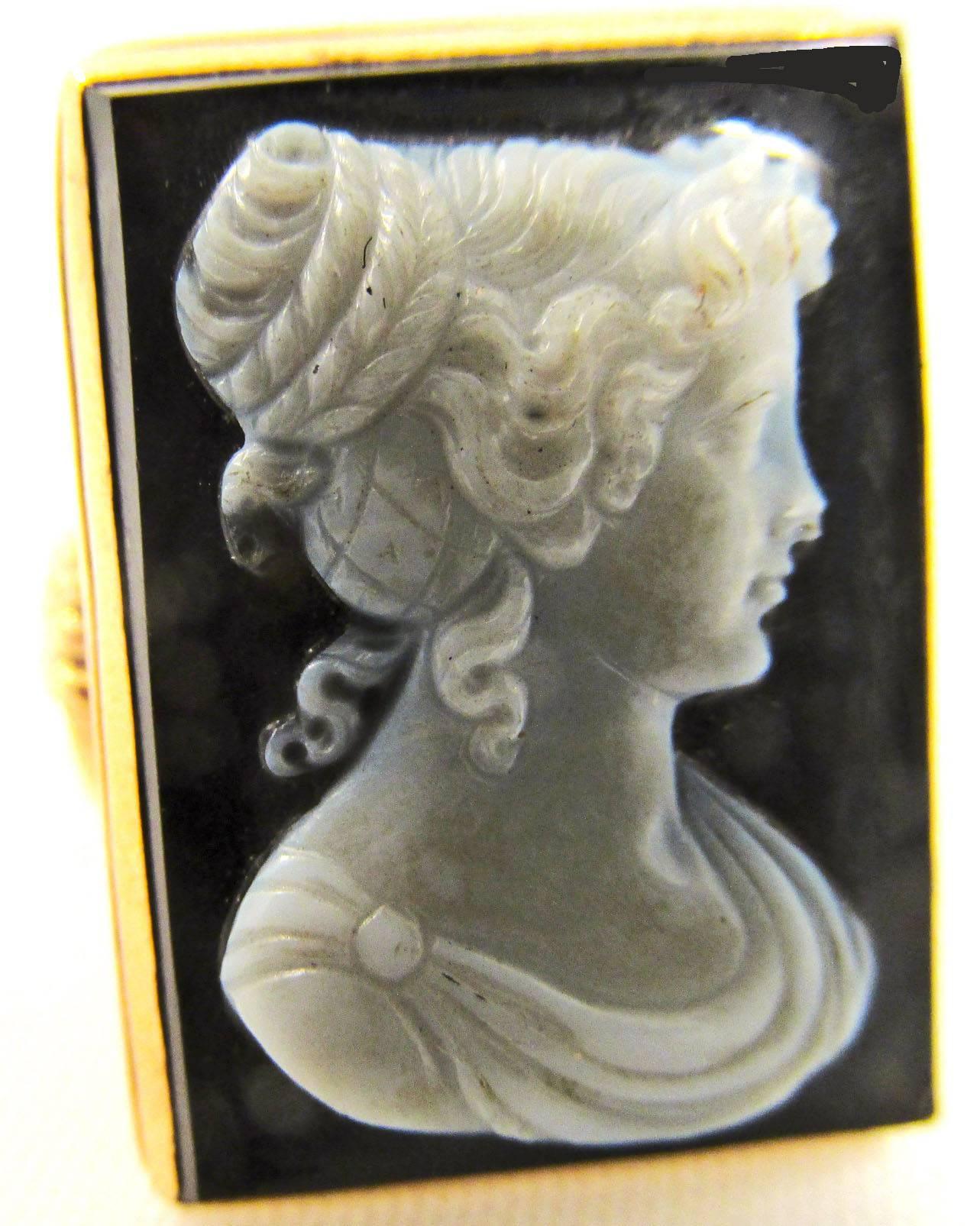 Elegant turn of century onyx cameo ring set in 14K gold depicting the profile of a lovely young Roman lady. The ring dates to 1900 and is a size 10. 