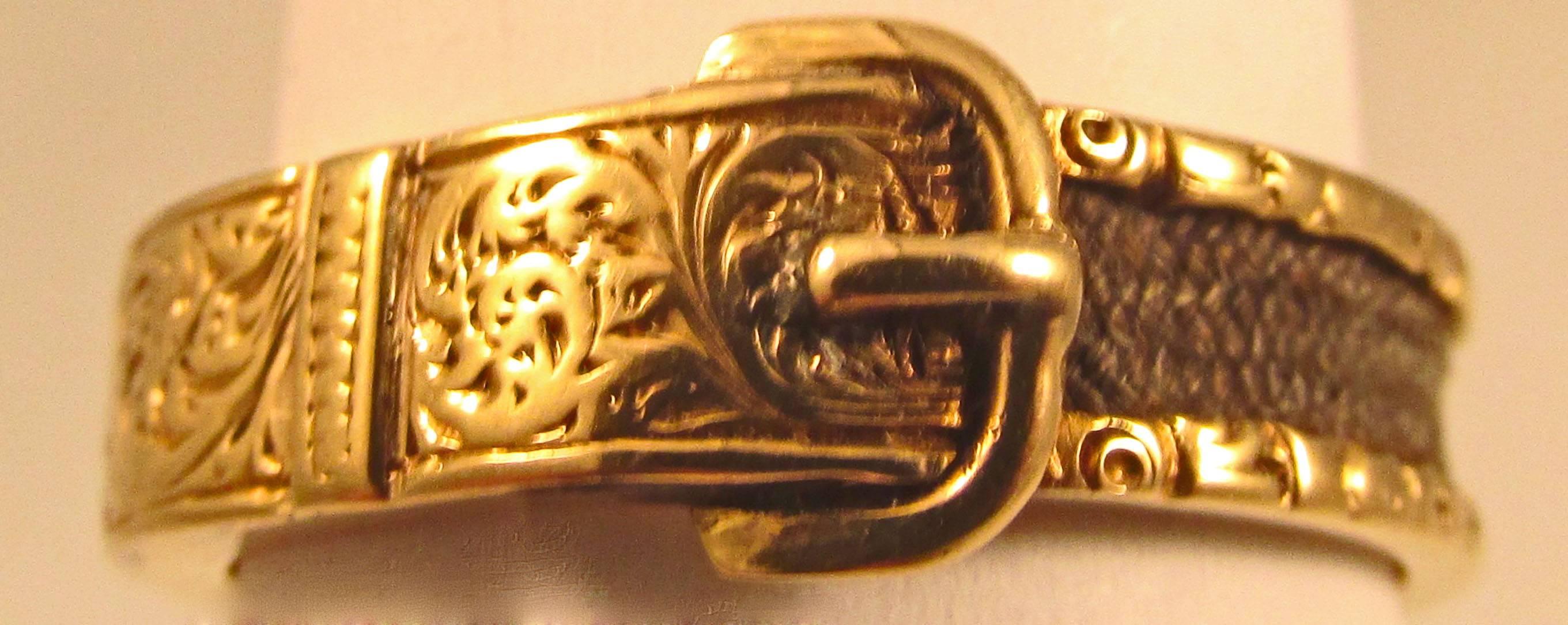 Elaborate Georgian buckle ring in 15K gold and plaited hair. The swirling gold work is amazing. The buckle was a symbol of the binding love between the giver and the wearer. The ring dates to 1840 and is a size 8. 