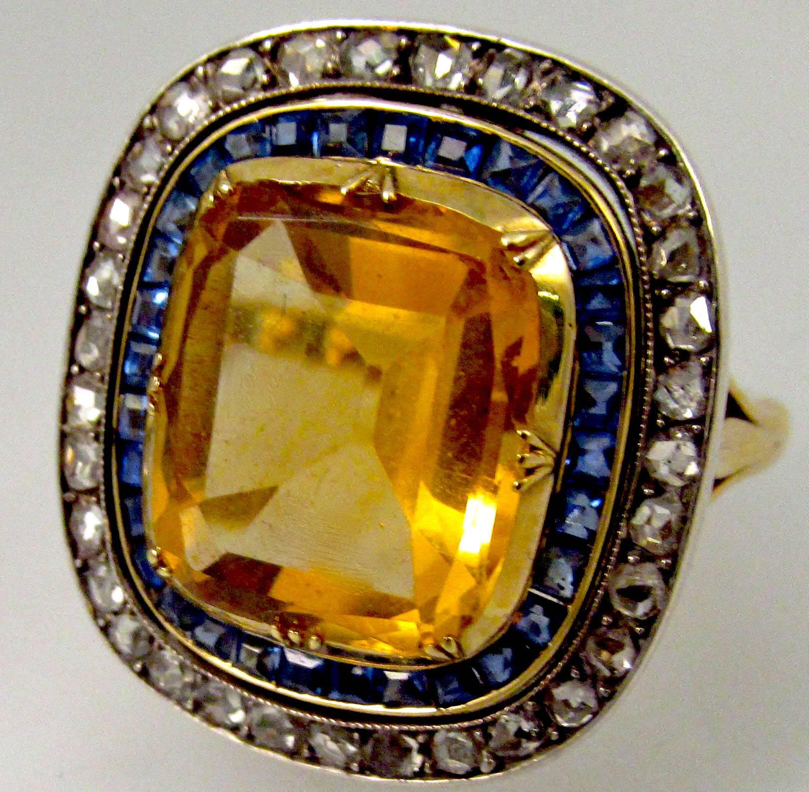 Bold  citrine ring surrounded by sapphires and diamonds set in 18K gold and silver. In addition, the ring comes with a pearl necklace and tools to  change the ring into the clasp for the necklace. An amazing piece of work. The ring is a size 6 3/4