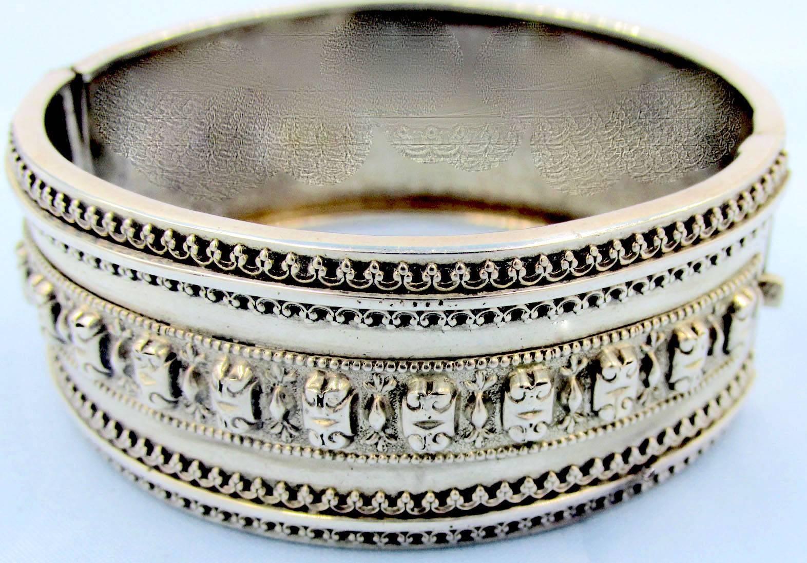 Victorian sterling cuff bracelet with an elaborate design of filigree and bead work. The bracelet is hallmarked Birmingham 1885 and measures 1" wide and has an interior measurement of 2" by 2 1/4". Wonderful to wear alone or paired