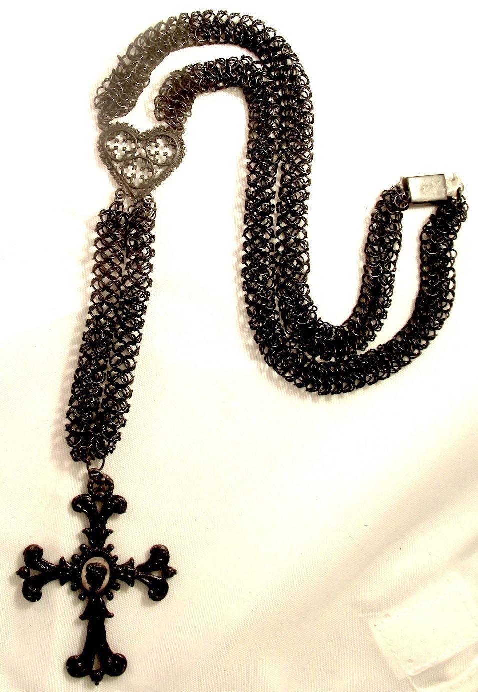 Antique 19th century Berlin Iron necklace with a Berlin Iron heart and cross. Berlin Iron jewelry is highly prized for its intricate work and rarity. During the Napoleonic Wars wealthy Germans gave their precious jewels for the war effort and