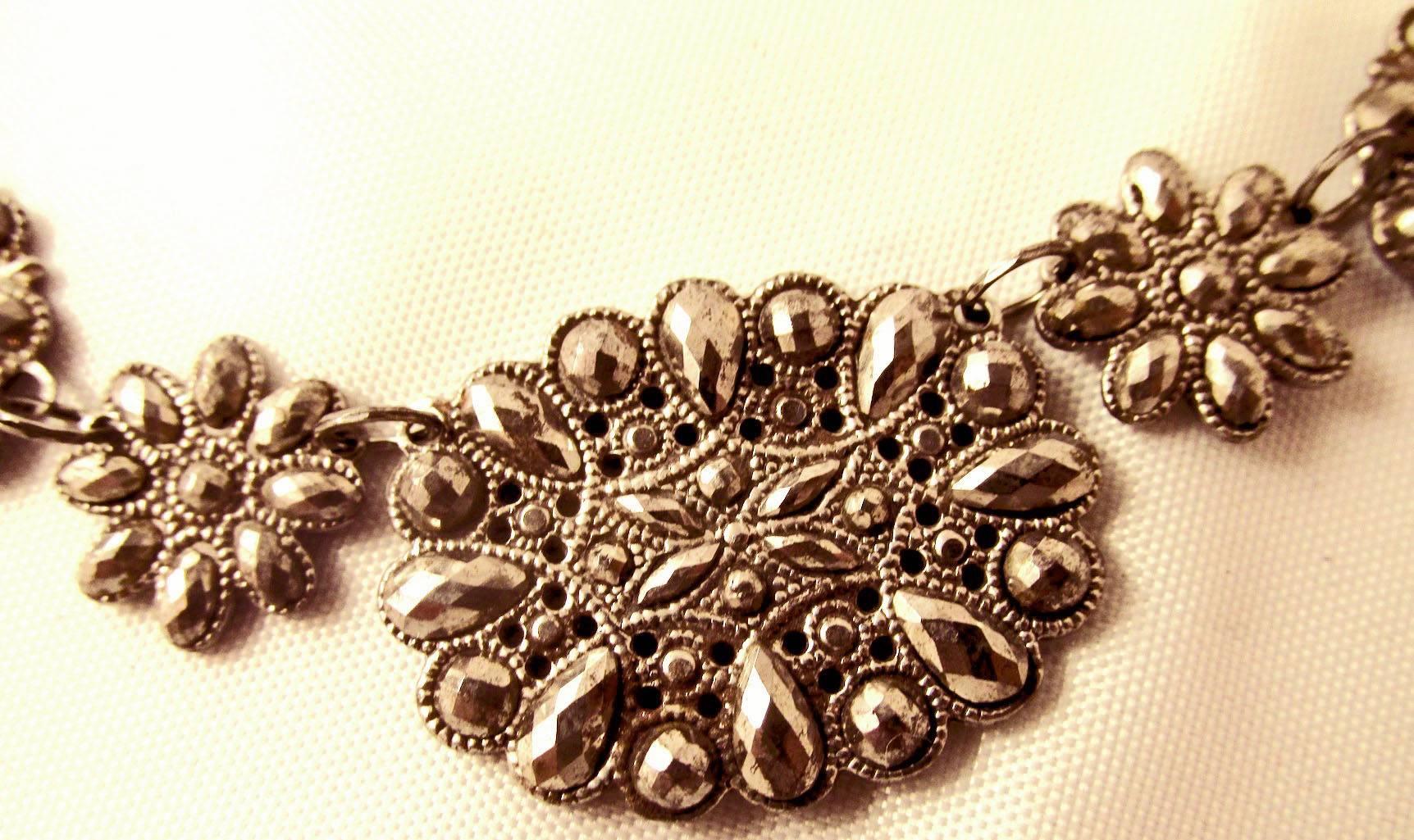Lovely Georgian early cut steel necklace with a floral motif. Cut steel was popular with the upper classes to wear while traveling. Afraid of highwaymen they left their diamonds safely at home. This piece is beautifully made, take note of the