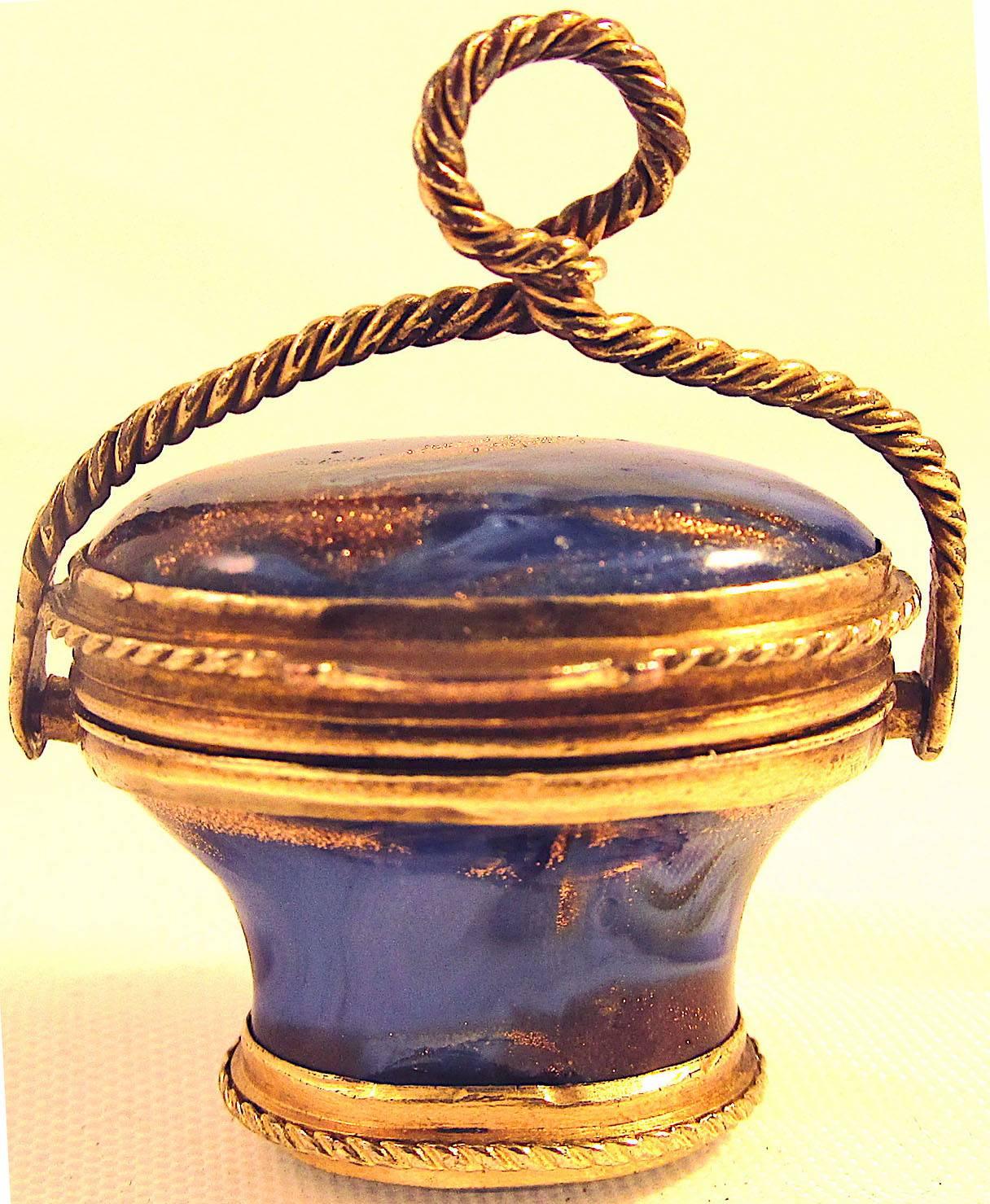 Lovely Georgian basket fob carved of lapis lazuli with pinchbeck fittings. This beautiful piece would have been worn by either a man or woman on their watch chain or sewing etui. It was likely used to store snuff. It measures 1" wide by