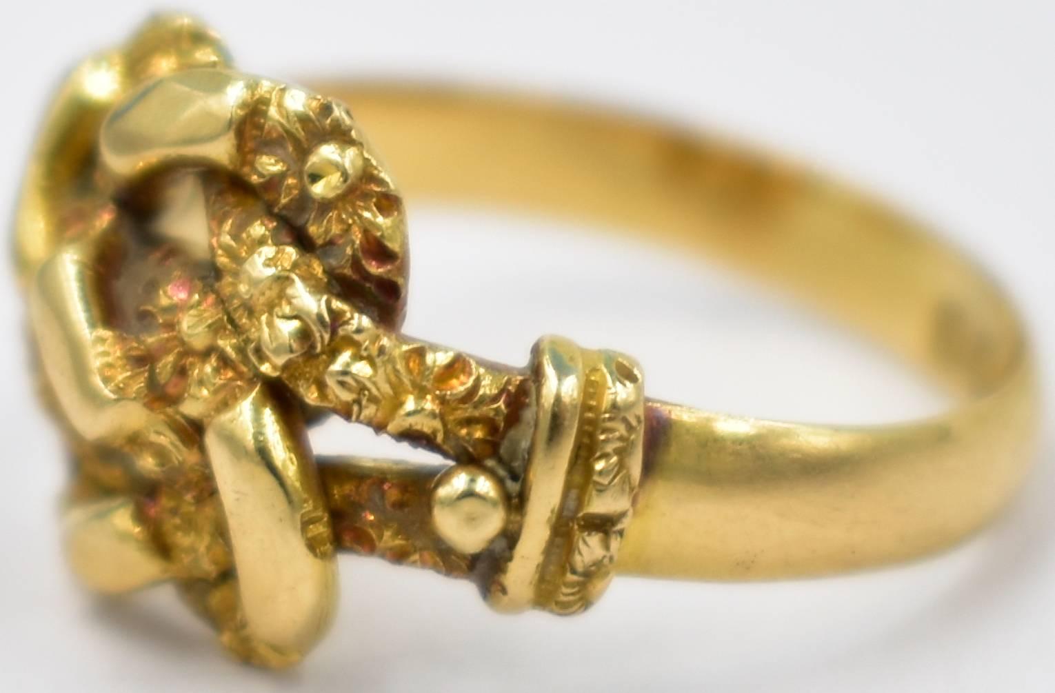 Edwardian 18K gold knot ring hallmarked Birmingham, 1904. This unusual knot ring, which measures a size 6 1/2, is carved with a floral motif. A rare and beautiful ring to wear day or night. 