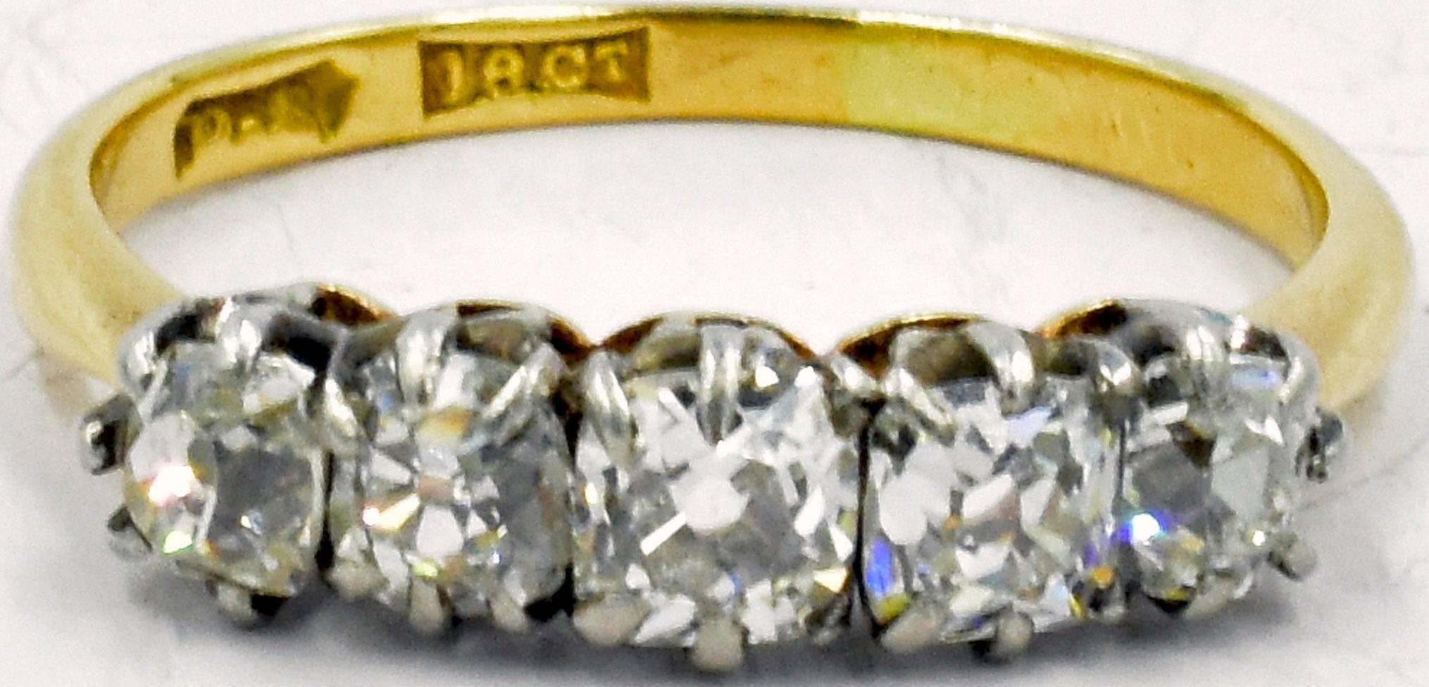 Wonderful 5 stone diamond ring dating to c. 1880 and set in 18K gold. The diamonds are old European cuts. The ring is a size 5 and measures 1/8" at its widest. The diamonds will sparkle on your finger and light up your life.