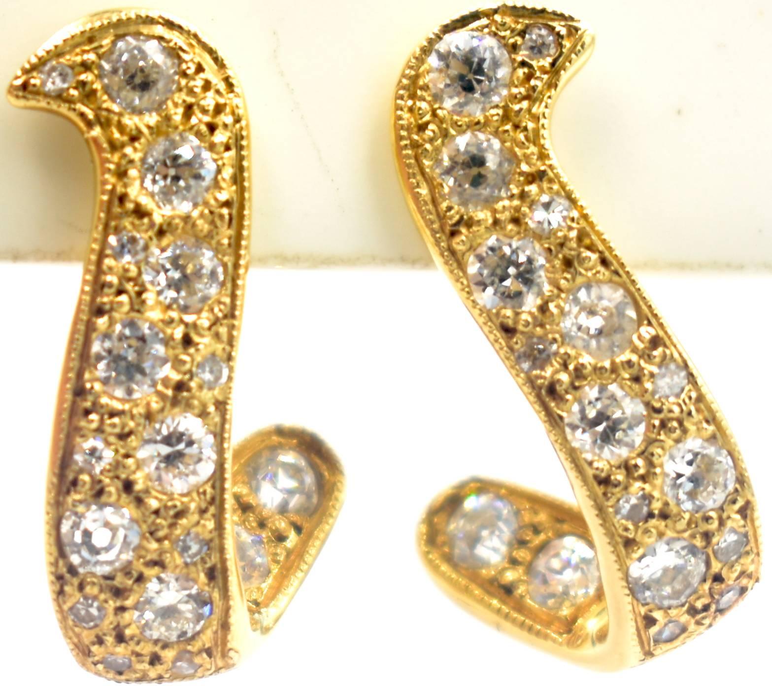 Delightful pair of 14K gold and diamond earrings in a softly swerving shape with screw back fittings. The clear, sparkly diamonds amount to 1.25 cts.
But the weight is not what it's all about.  It's the intricacy of the design and the detail of the