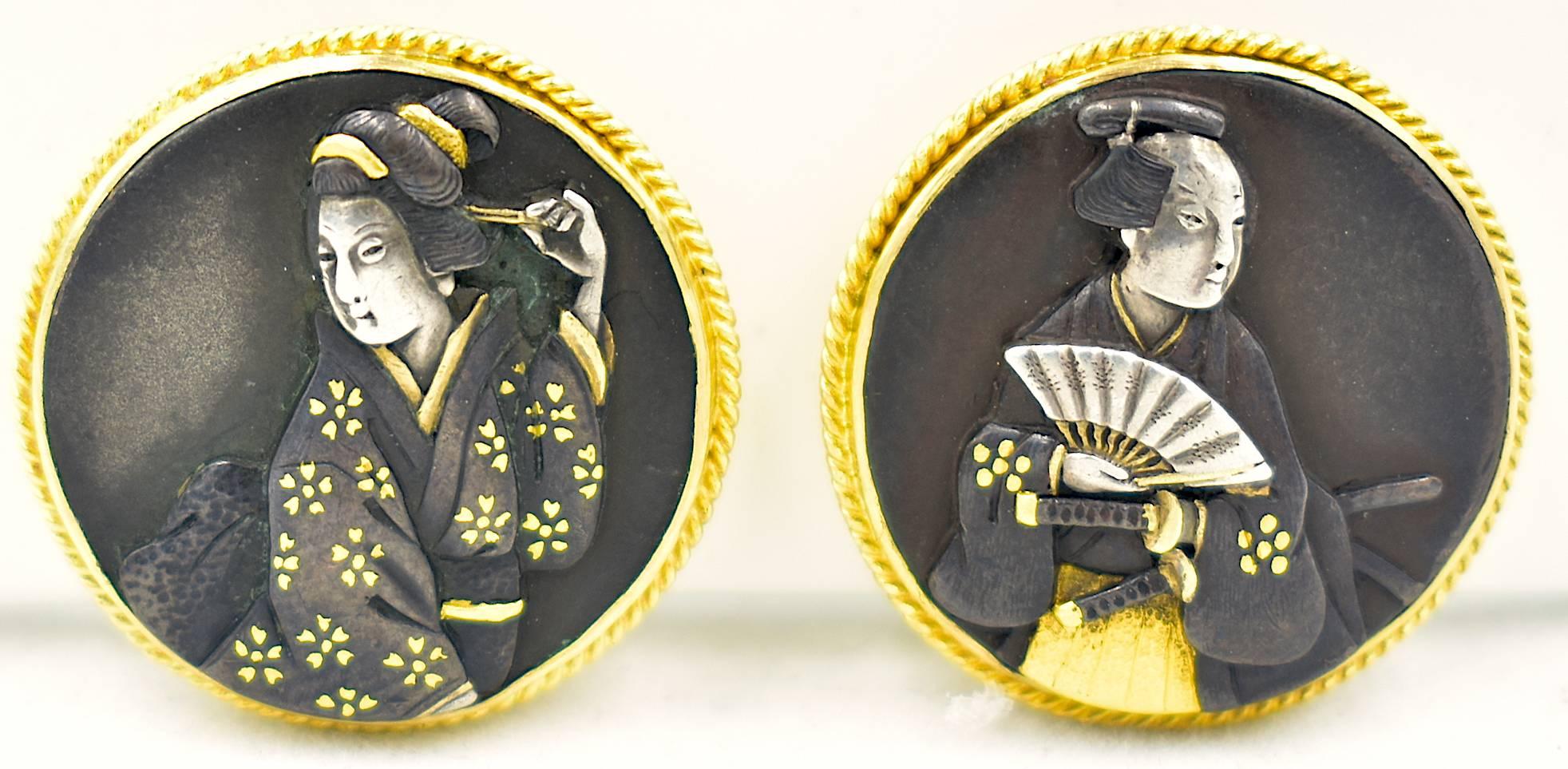 Wonderful early 20th century shakudo earrings each depicting a unique geisha. Shakudo is made of mixed metals, mainly gold and copper which was originally used to make armaments. These easy to wear clip on earrings are perfect for work and play.