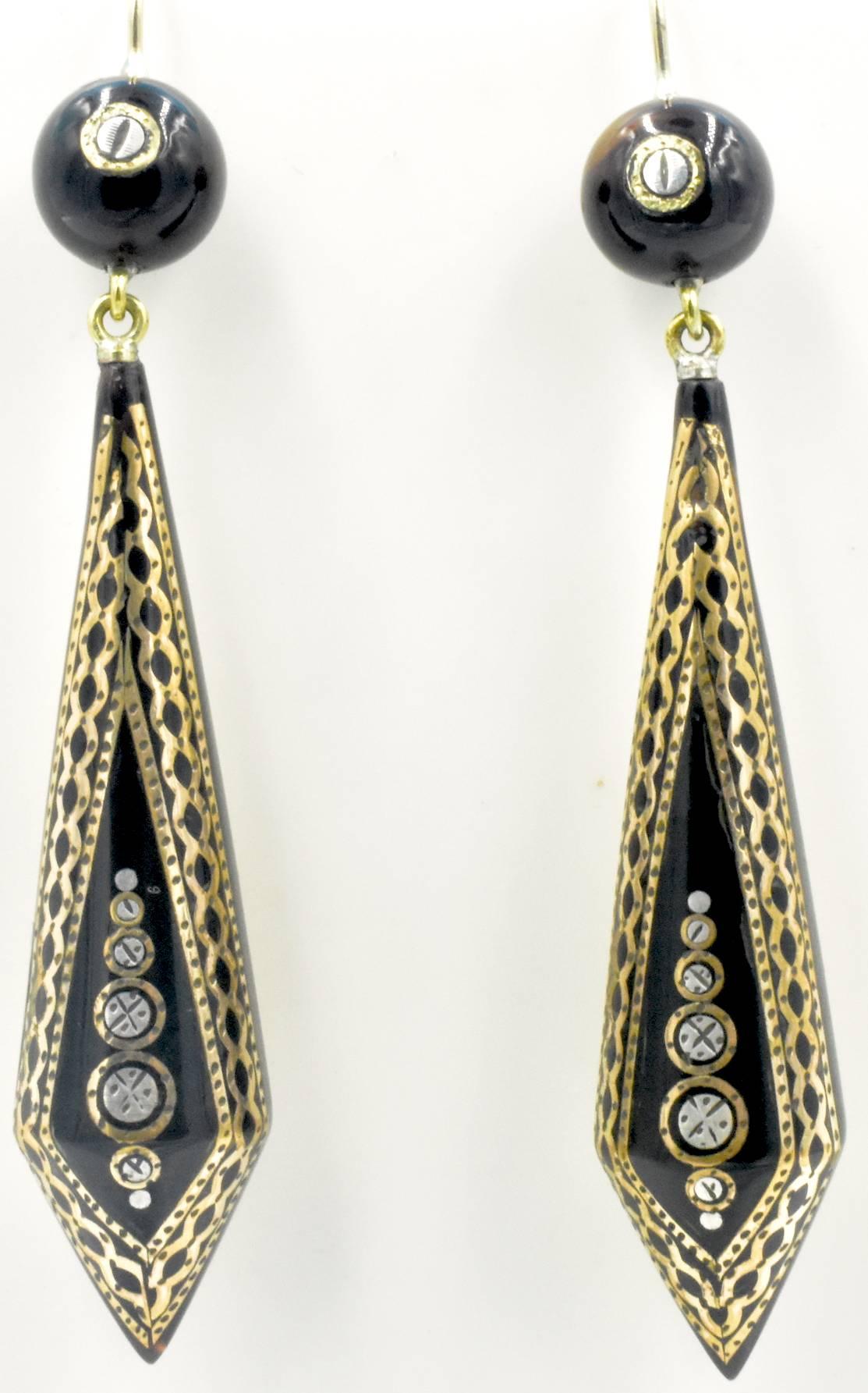 Elegant Victorian pique drop earrings inlaid with gold and silver in a beautiful geometric design. Pique, the technique of inlaying precious metals into tortoiseshell, was brought to England by the Huguenots when they were expelled from France in