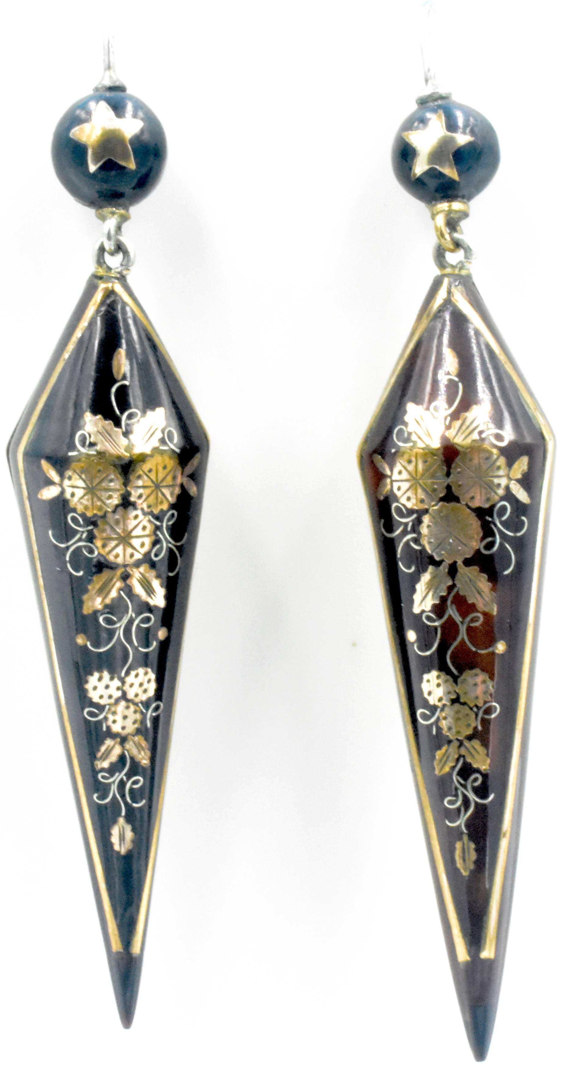 Elegant pique long drop earrings. Pique is tortoiseshell inlaid with gold and silver, a technique brought to England by the Huguenots when they were expelled from France in the 17th Century. This jewelry became very popular for its beauty and