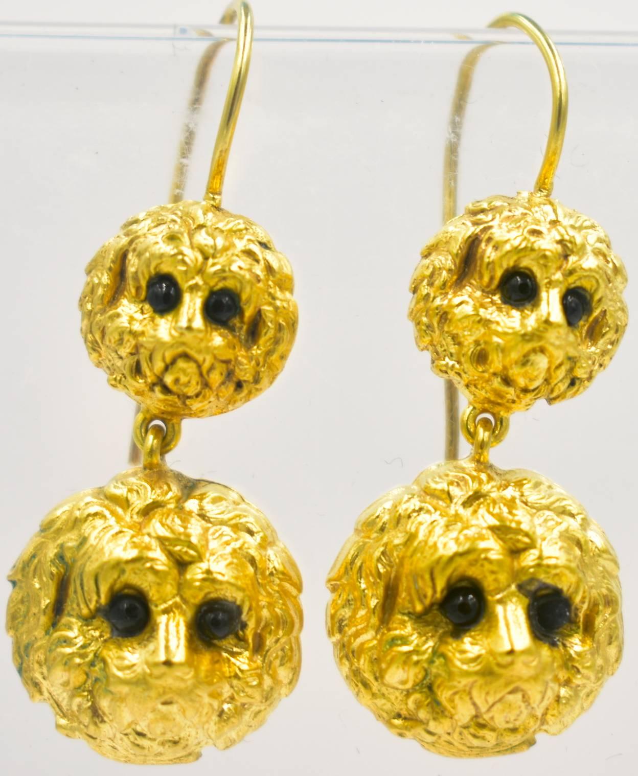 Delightful Victorian dog head earrings of pinchbeck set with black glass eyes. Pinchbeck is an alloy named for Christopher Pinchbeck who was a watchmaker and developed the alloy for his watch cases. It has no gold in it but does not tarnish and