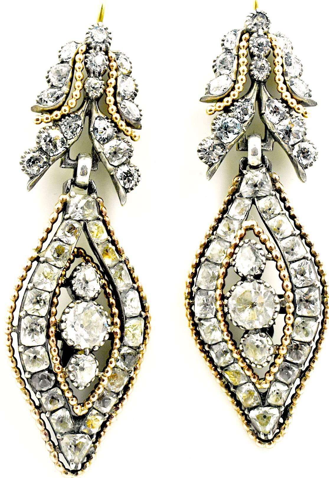 Antique Portuguese rock crystal drop earrings set in silver and 18K gold. The crystals are edged with gold beading that emphasizes the shape and design of the earrings. They date from 1800 and measure 2 1/8