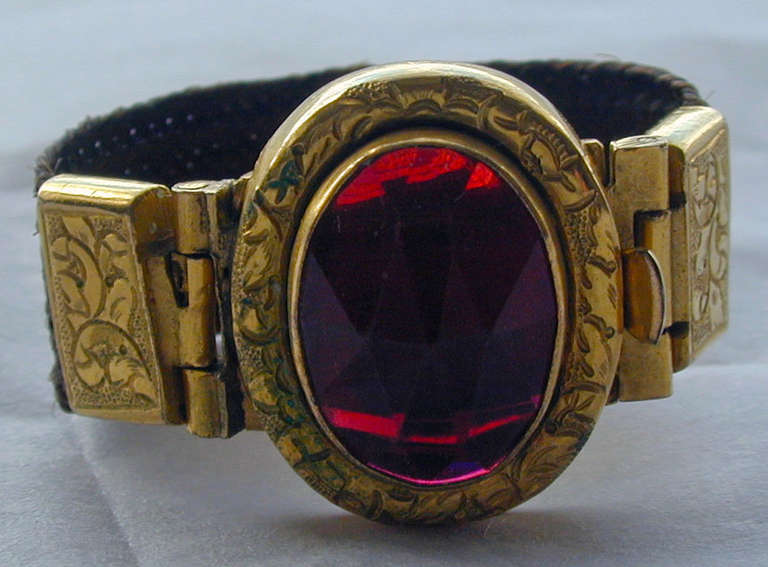 Early Victorian 9K gold, garnet and hair ring or scarf buckle. This amazing early ring has a clasp to allow it to be used as a scarf buckle as well as a ring. Woven hair was used in jewelry as a memento of a loved one who may have a life at sea or