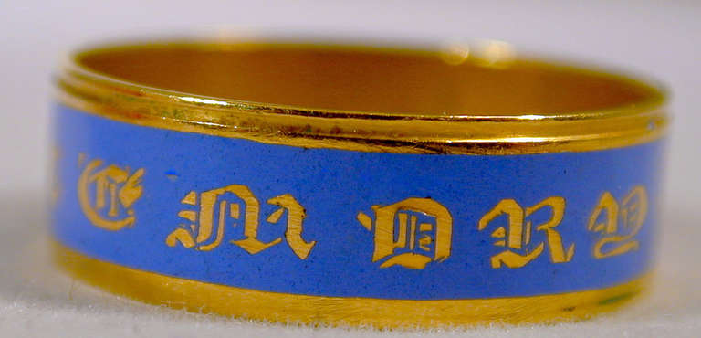 Early Victorian memorial band in 18K gold and decorated in an azure or cerulean blue enamel, an unusual color rarely found in rings of this type. The outer band says 