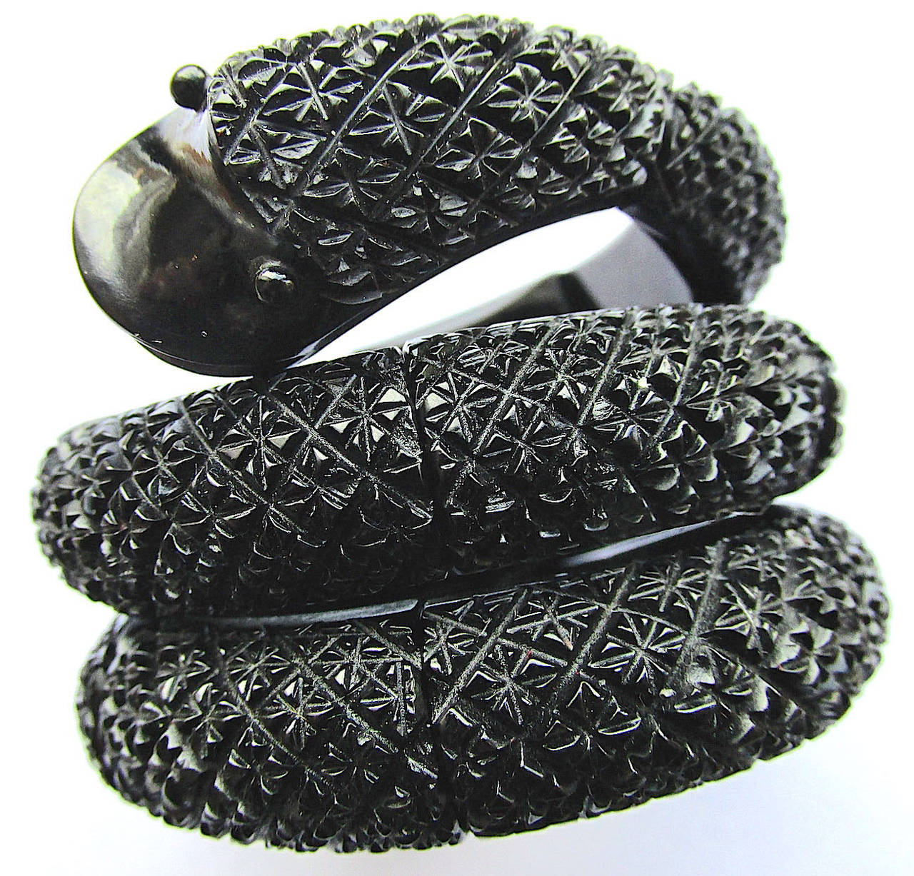 Fantastic Victorian Whitby jet coiled snake bracelet hand carved from the jet mined in Whitby England. Jet jewelry became popular after the death of Prince Albert when Victoria went into mourning and the only jewelry permitted at court was jet.