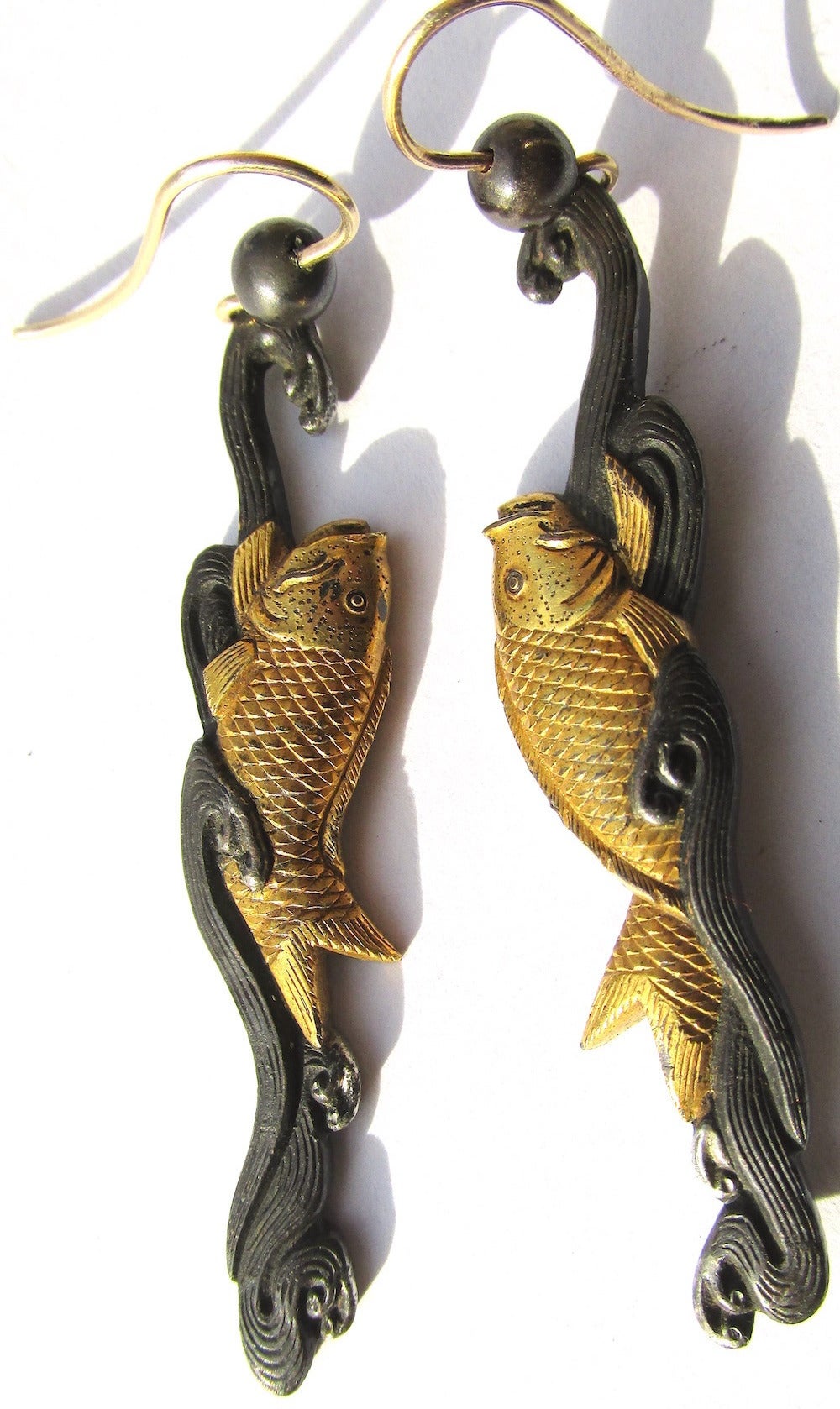 Charming Victorian Japanese Shakudō  earrings with a dangling fish. The high gold content in Shakudo objects when treated with copper forms an indigo/black patina resembling lacquer. Historically Shakudō was used in Japan to construct or decorate