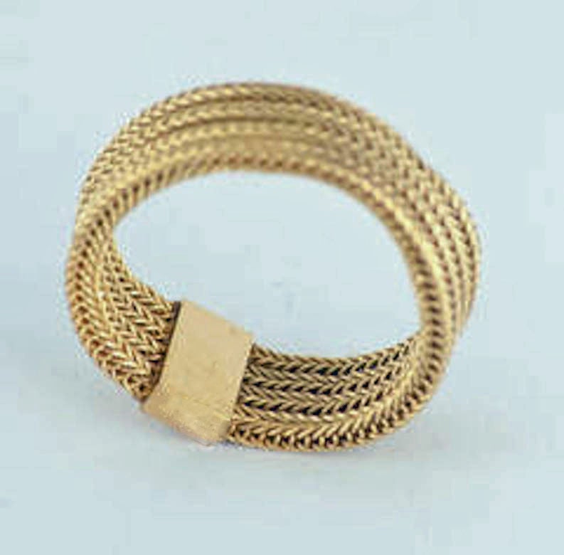 Unusual Georgian flexible mesh band of 18K three color gold. Wonderful as a wedding band or to stack with other rings. The ring is a size 7 1/4 and measures approximately 1/4
