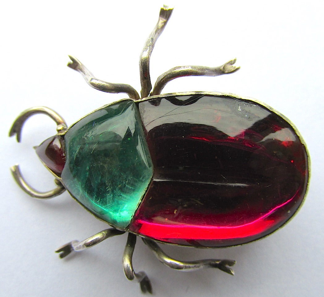 Fantastic Victorian foiled rock crystal beetle brooch set in silver. The wonderful colors shimmer and gleam in daylight or candlelight. Whether perched on a shoulder or lying on a lapel the happy critter will glitter and glow greeting friends with a
