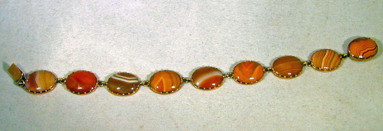 Lovely Georgian carnelian bracelet set in 12K gold. The fluctuating orange colors create a sense of movement and energy along with the variegated patterns in the stones. This bracelet will bring a vibrancy to one's wardrobe. It measures 7