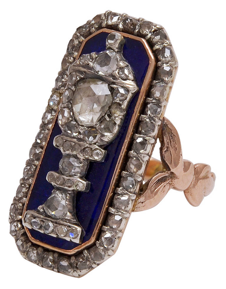 Magnificent Georgian urn ring set with rose diamonds on blue enamel in 15K gold. The elaborate cut of the large stone is called a Dutch crown. The ring is a size 5 3/4 and it measures 1 1/8