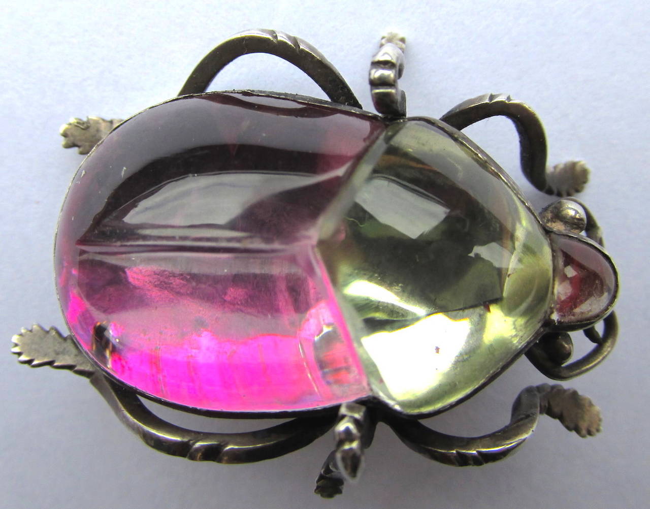 Colorful Victorian rock crystal bug pin in delightful colors of yellow and pink and purple set in white metal. Fun to wear alone on a lapel or with companions on one's shoulder. The pin measures 1 5/8