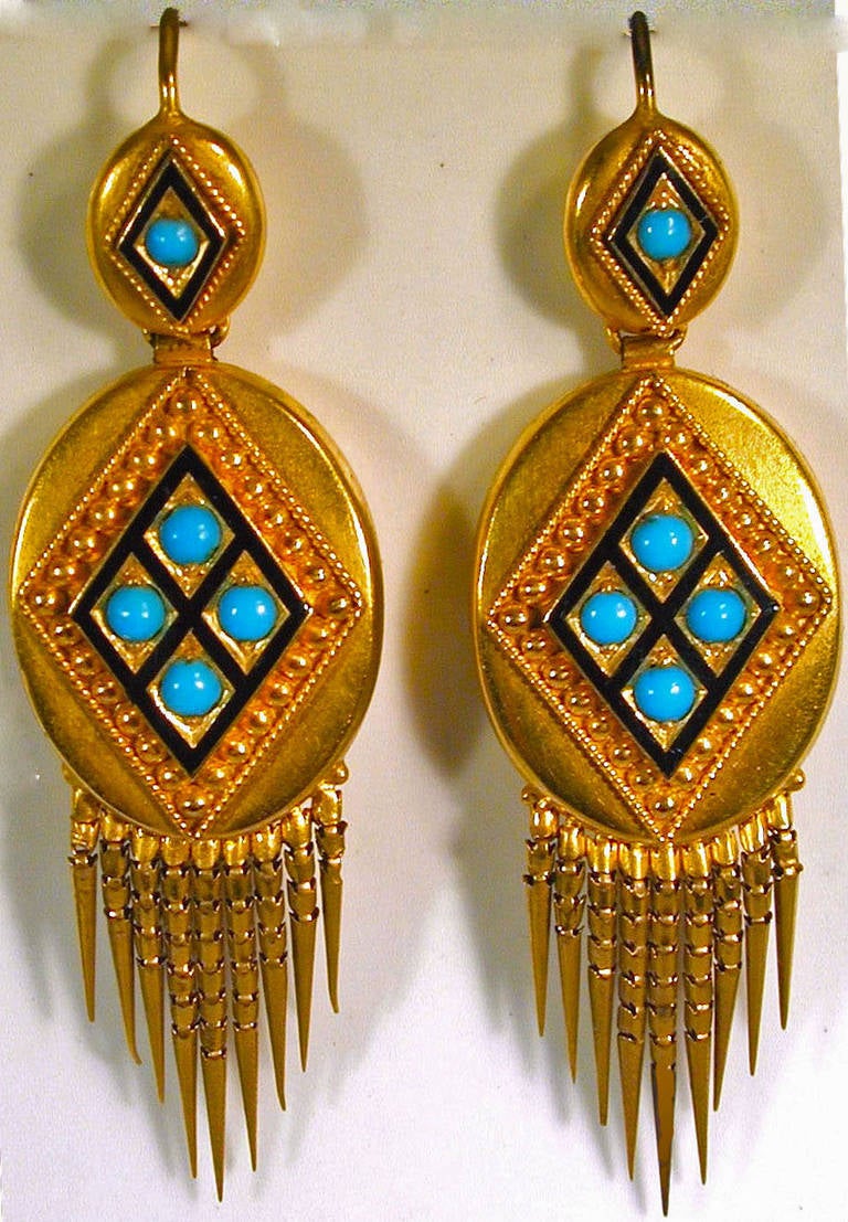 Dramatic Victorian 18K gold fringe earrings decorated with black enamel and set with turquoise. The design is enhanced with beaded cannetille decoration. The earrings measure 2
