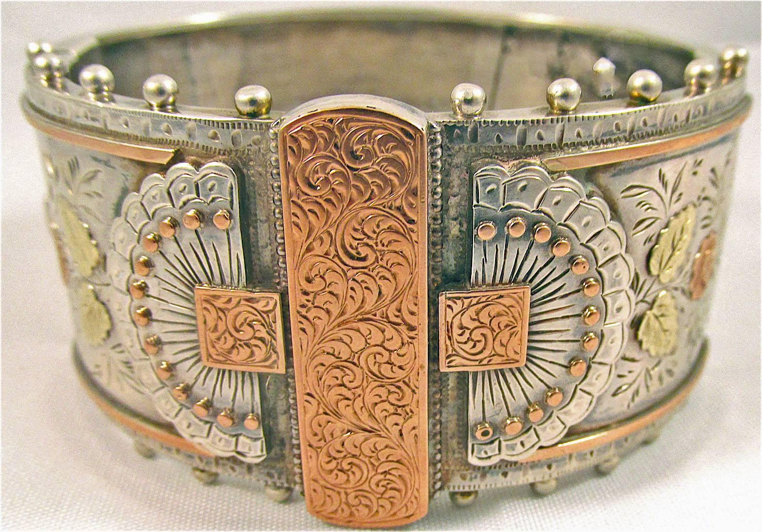 Wonderful Victorian sterling cuff bracelet with a striking design in two-color gold and with beading around the edges. The picture on the hand shows how fantastic this piece is. The bangle measures 1 3/8