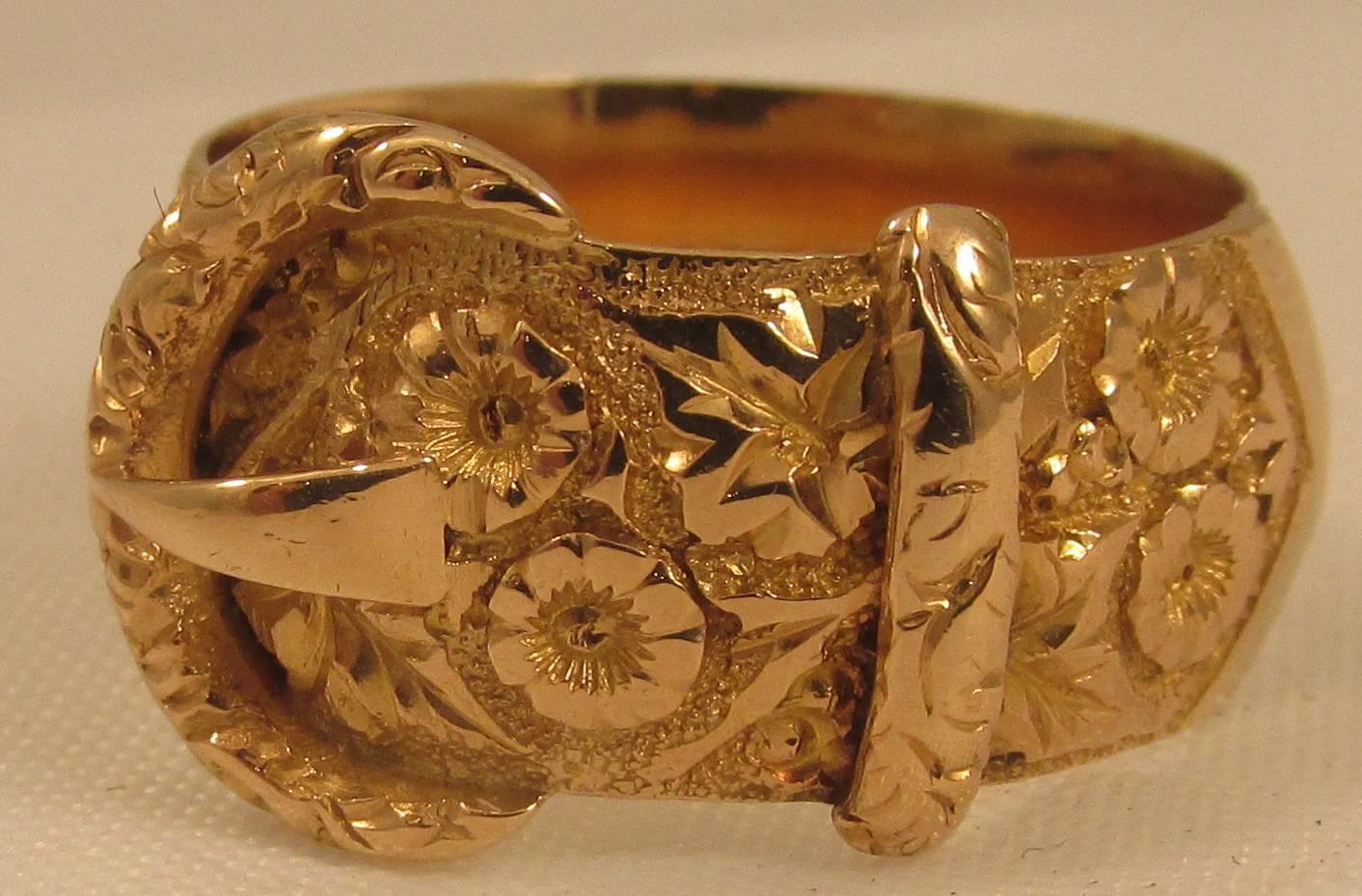 Wonderful Edwardian 18K gold buckle ring with an elaborate floral repousse design. Buckle rings and motifs were popular throughout Queen Victoria's reign.The one shown here is a beautiful example. The ring is a size 8 and has hallmarks for