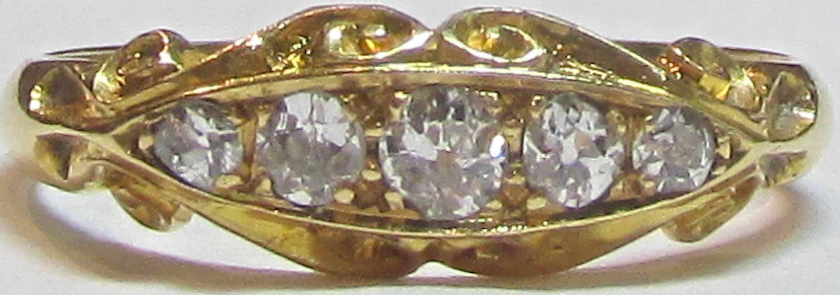 Wonderful Victorian five stone diamond ring in an elaborate 18K gold setting. The ring is a size 6 1/2 and has full hallmarks for Birmingham England 1864 in addition to the makers hallmarks. Great to wear alone or with other band rings.
