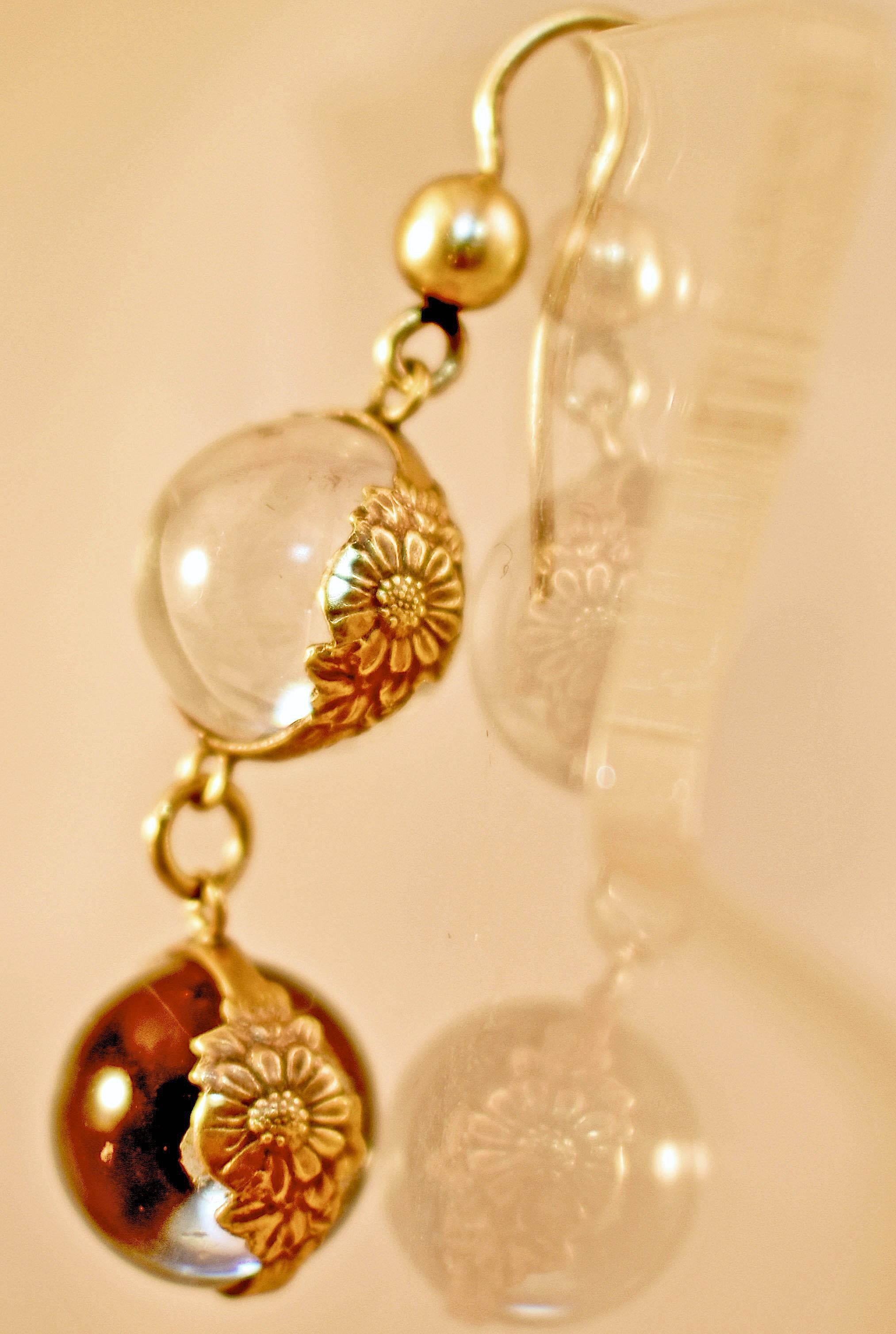 Lovely late Victorian rock crystal earrings set in 9K gold. The crystal orbs were called pools of light. In the Chinese tradition, each crystal orb contains a bit of chi (good energy) within it. These earrings will bring that chi to the one lucky