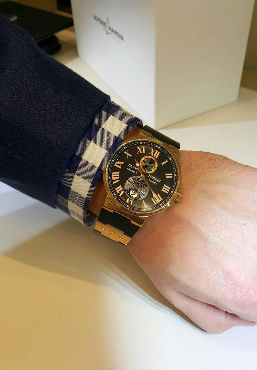 This striking timepiece is part of the Ulysse Nardin, Le Locle Suisse collection, style number 266-67. The watch is comprised of 18 karat rose gold and features a black rubber strap. The timepiece features a deploy strap, chronometer and an