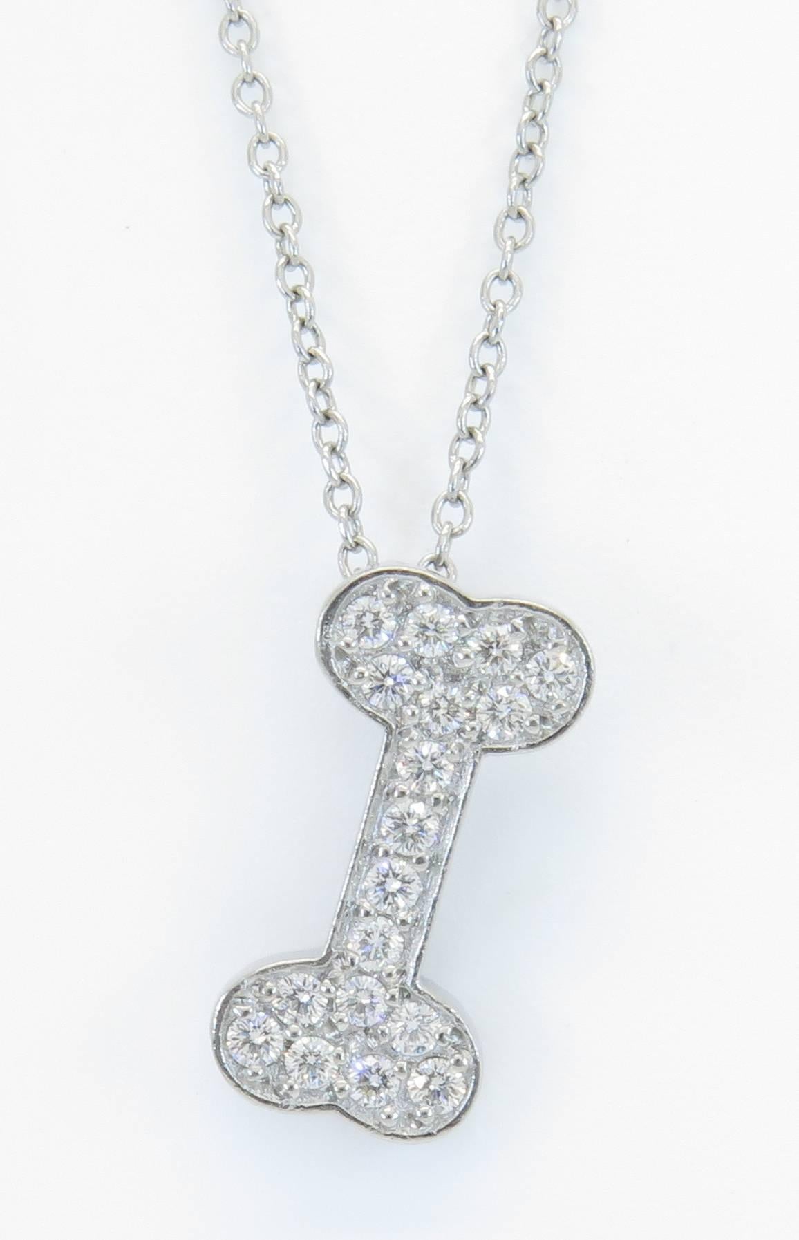 This pendant is perfect for any dog lover! The pendant features 18 round brilliant cut diamonds weighing in total 0.25 carats. The diamonds are F-G in color and VS2-SI1 in clarity. The diamonds are bright white and eye clean. The diamonds are prong