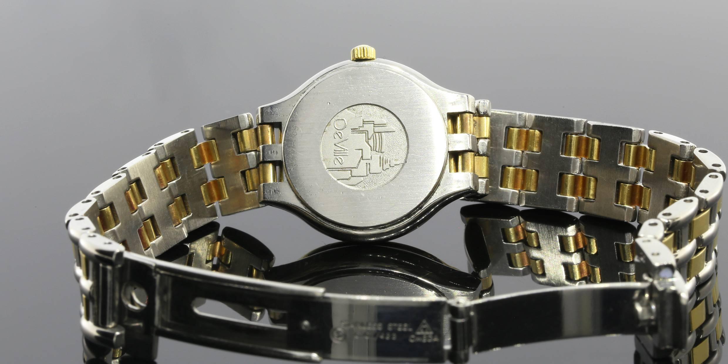 This is a beautiful stainless steel & 18 karat yellow gold Omega watch from the Deville collection. The 18 karat yellow gold bezel perfectly compliments the white dial of this elegant timepiece. This watch would be a perfect addition to any woman's