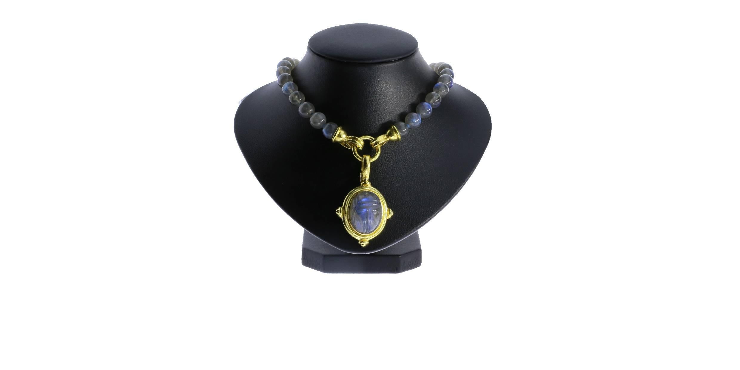 Elizabeth Locke is known for her Etruscan, Greek and Roman inspired neoclassical hand-made jewelry. This necklace features a scarab pendant carved from stunning labradorite. Labradorite is a gemstone unlike any other with its beautiful iridescent