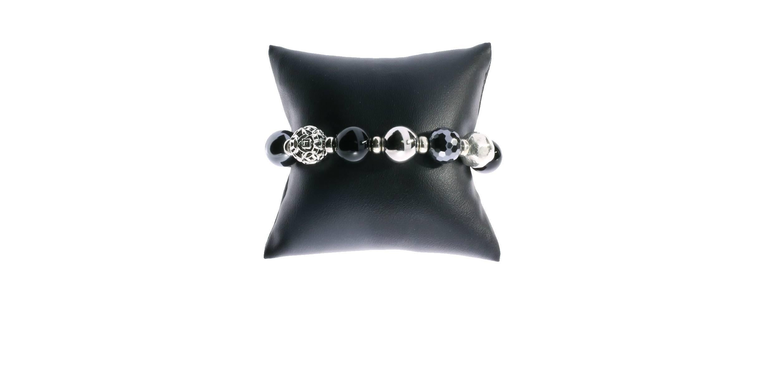 This David Yurman bead bracelet is from the Elements collection. It features sterling silver, onyx, and hematite beads, strung on sterling silver box chain, Each bead has a unique design making this bracelet really stand out. A gorgeous addition to