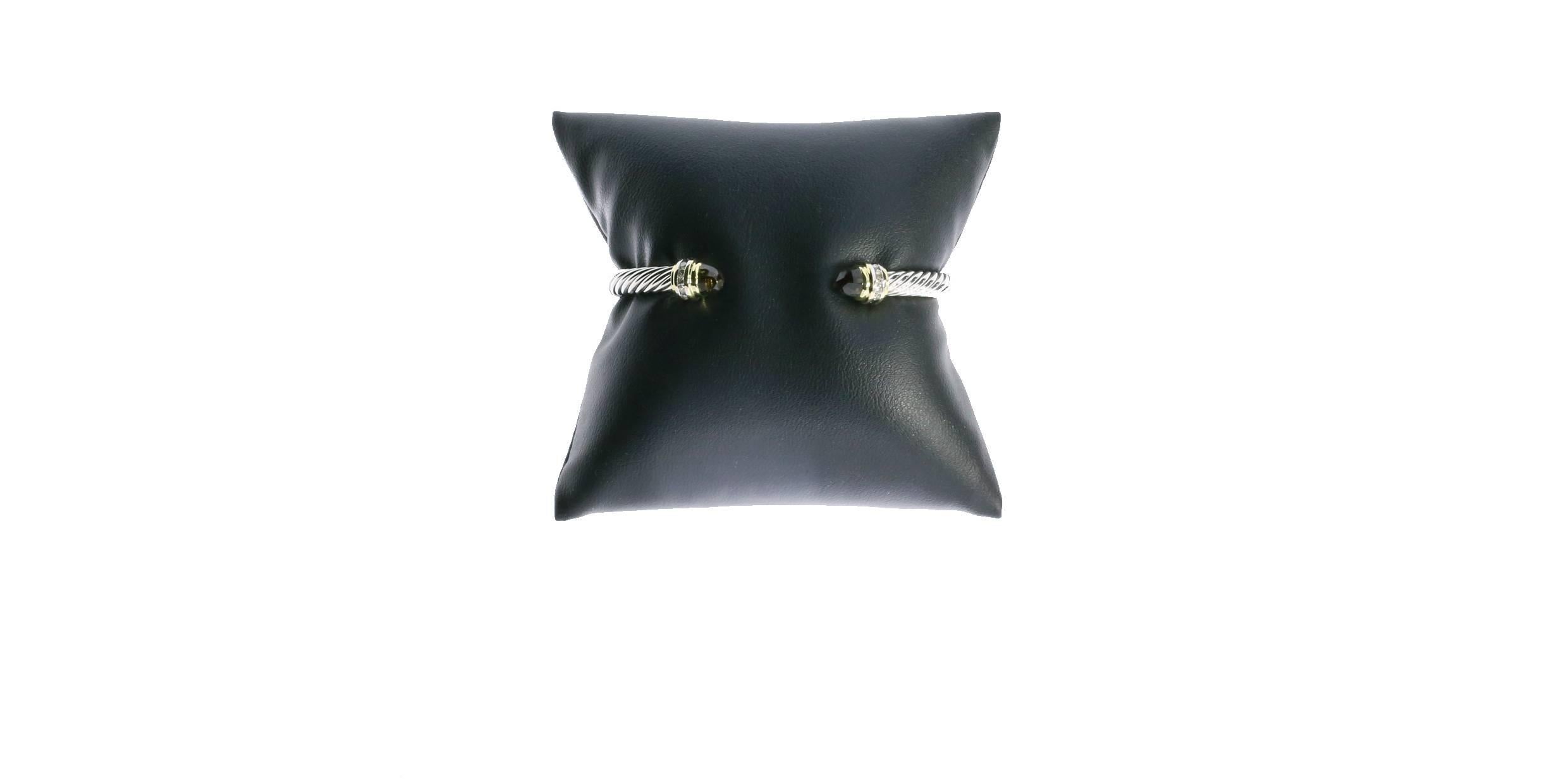 David Yurman's cable style jewelry has become his signature, the unifying element of every collection. This beautiful Cable Classics Collection bracelet is 5mm in width and has faceted smokey quartz end caps. The end caps are accented with diamonds