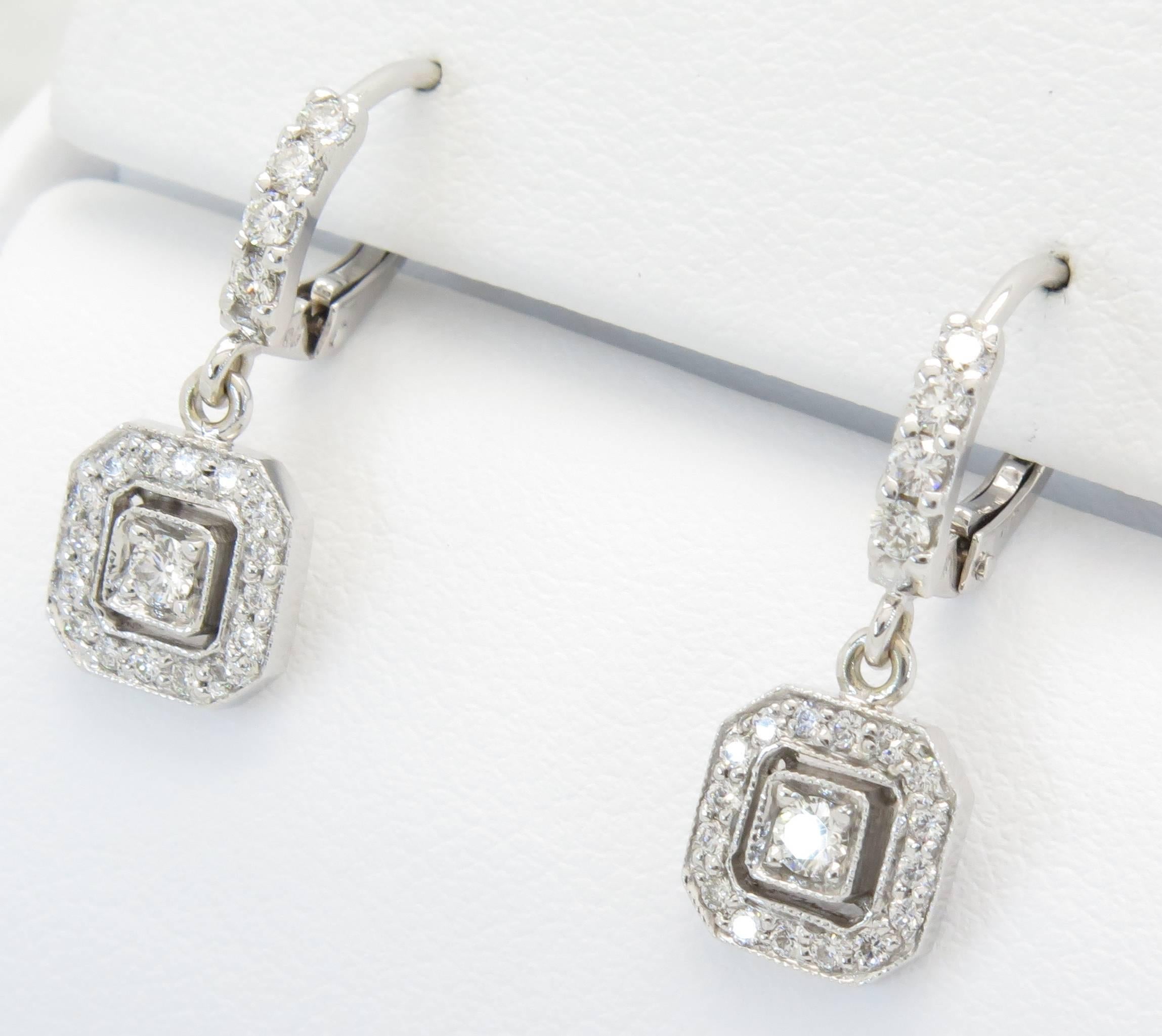 These gorgeous earrings are from the designer Penny Preville. The earrings feature 0.25CTW of round brilliant cut diamonds. The diamonds are set in a octagonal drop, with lever backs. The diamonds are GH/SI1 in quality. The earrings are comprised of
