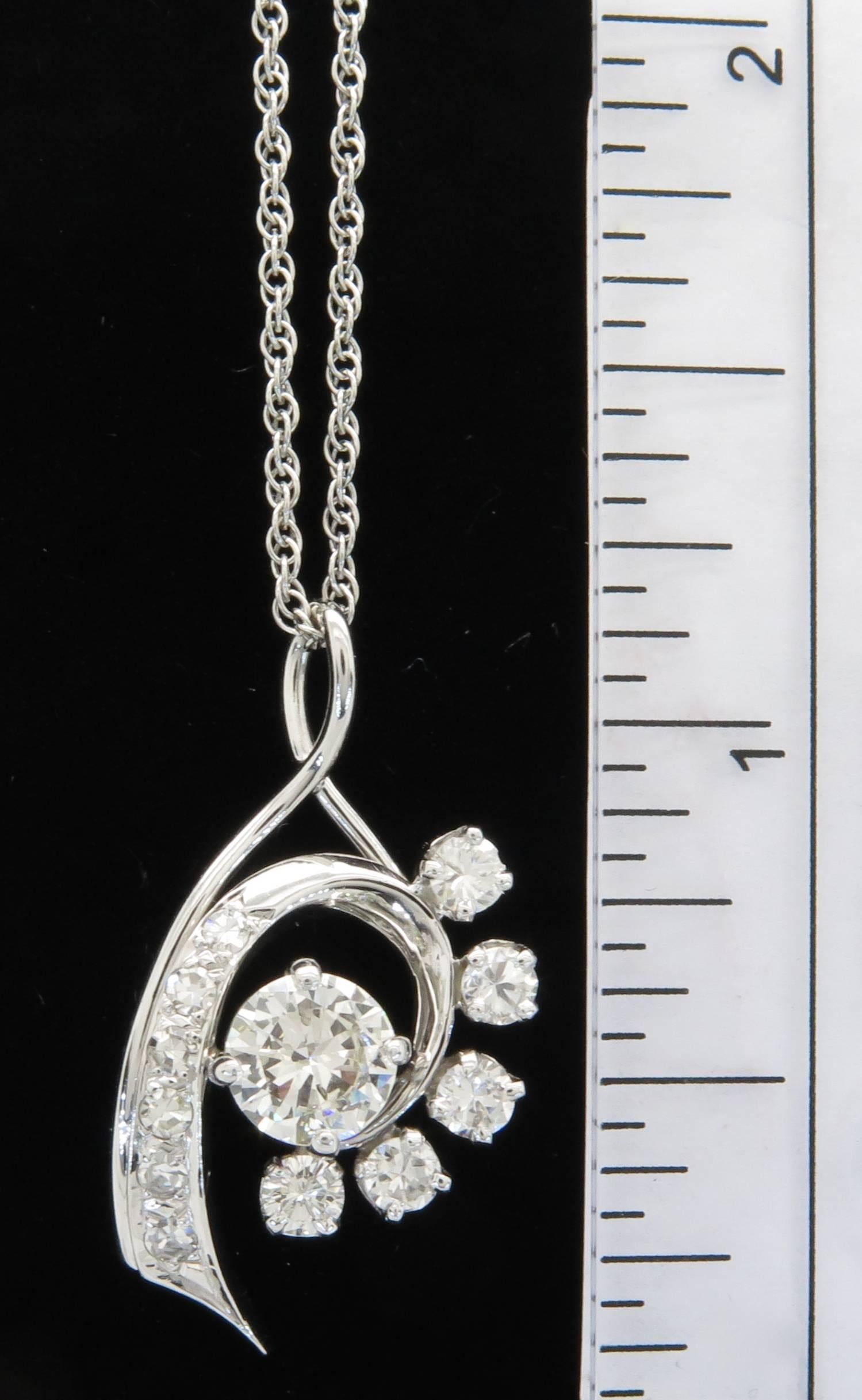 This unique pendant features 5 round brilliant cut diamonds and 6 single cut diamonds, weighing in total 0.67 carats. The diamonds are G-H in color and VS1 in clarity. The diamonds are bright white, with no eye visible inclusions. The diamonds are