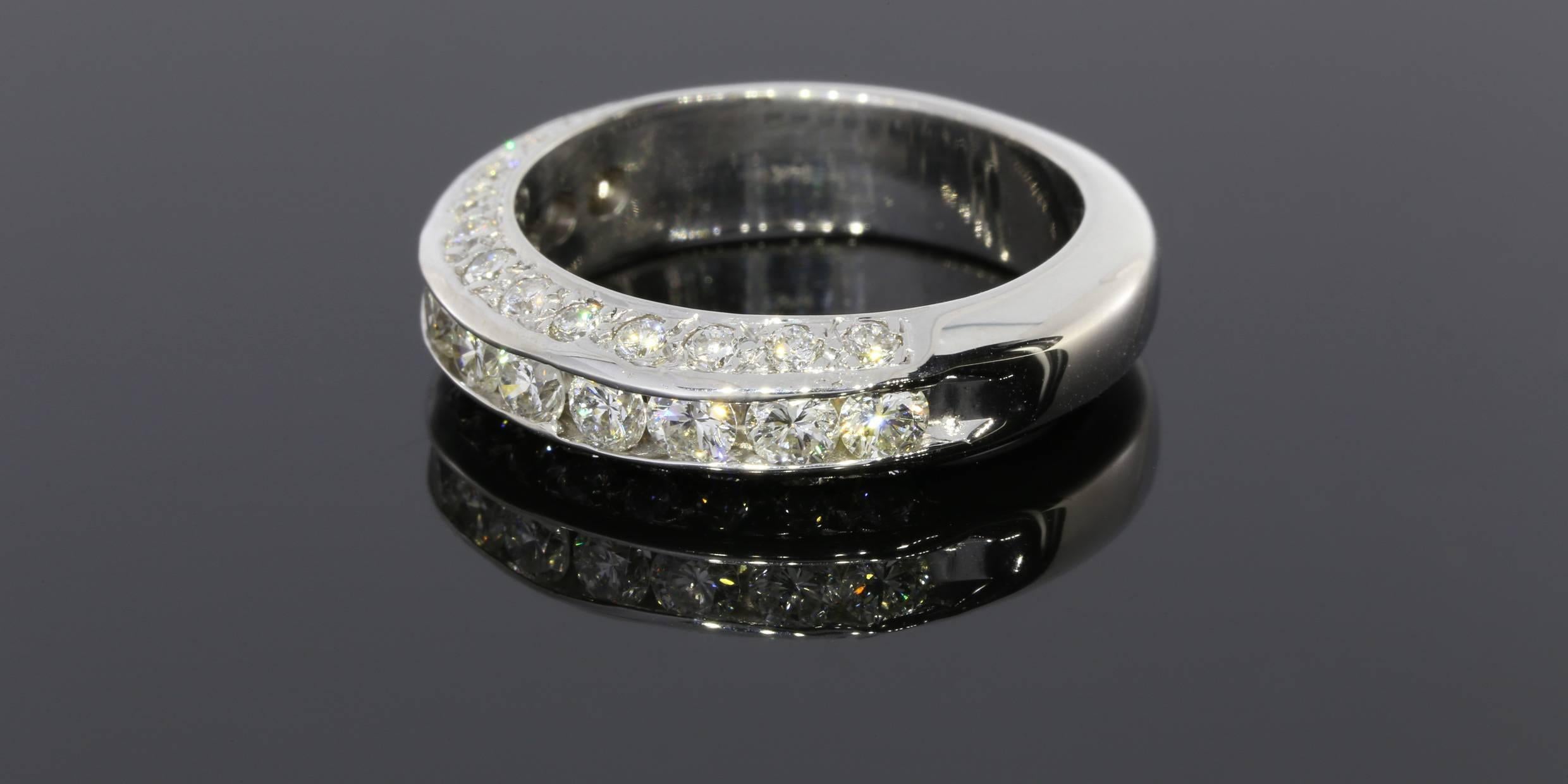 This gorgeous ring sparkles from all sides & is just breathtaking! The center row features larger round brilliant cut diamonds that are channel set, & the sides feature smaller round brilliant diamonds that are bead set. All these beautiful diamonds