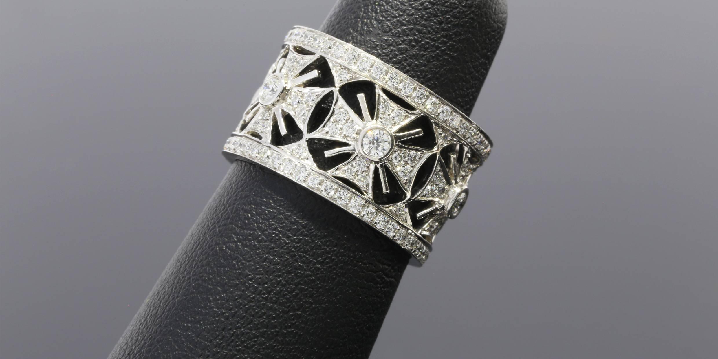 This one-of-a-kind band ring was custom made to feature a vintage inspired design of Maltese crosses in diamonds & white gold. The diamonds have a combined total weight of 1 carat & are bead & bezel set. The ring is comprised of 18 karat white gold.