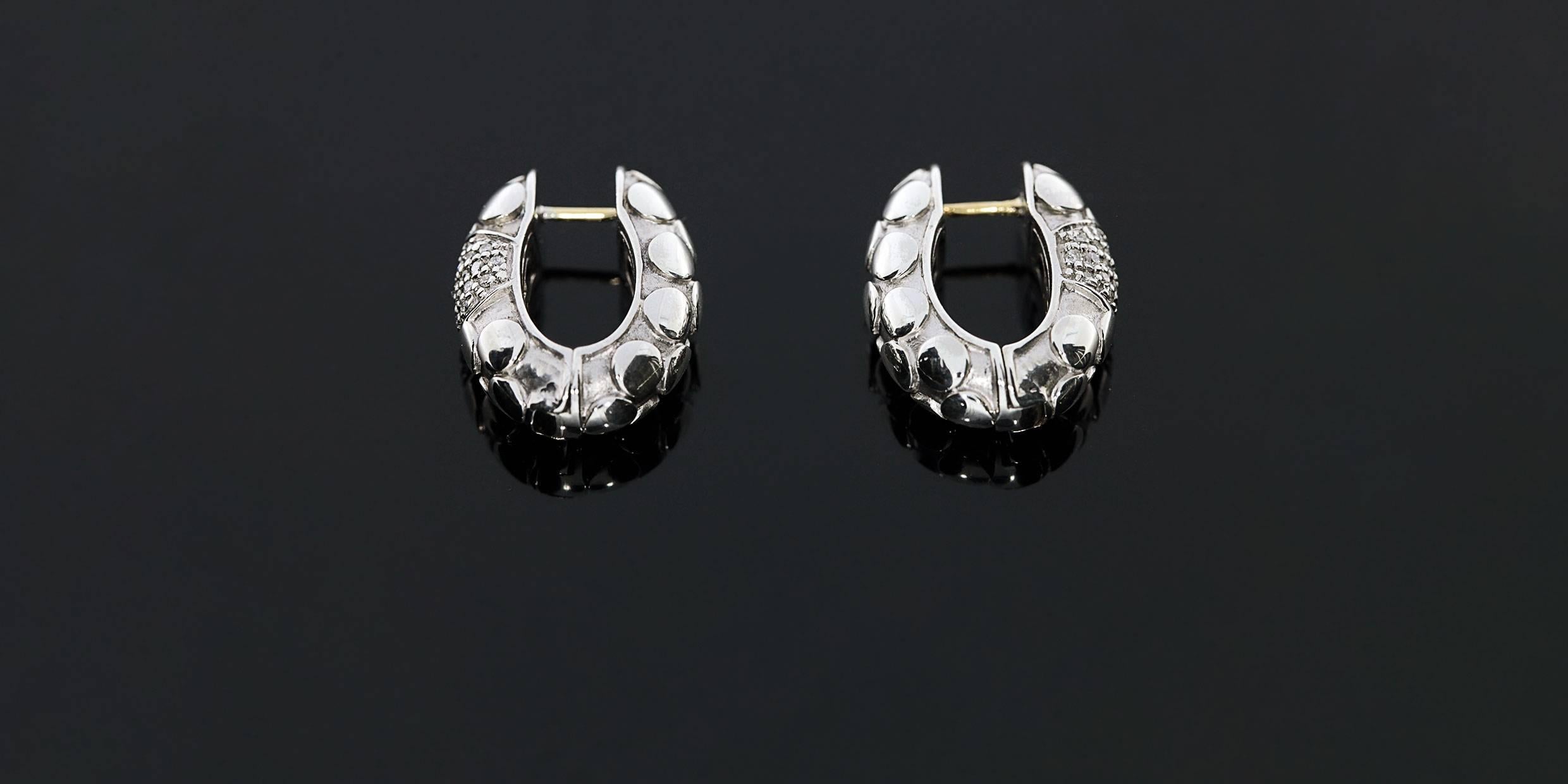 Each piece of John Hardy jewelry has been hand crafted in Bali since 1975. John Hardy is dedicated to creating timeless one-of-a-kind pieces that are brilliantly alive. These beautiful earrings feature Hardy's Kali dot design in sterling silver,
