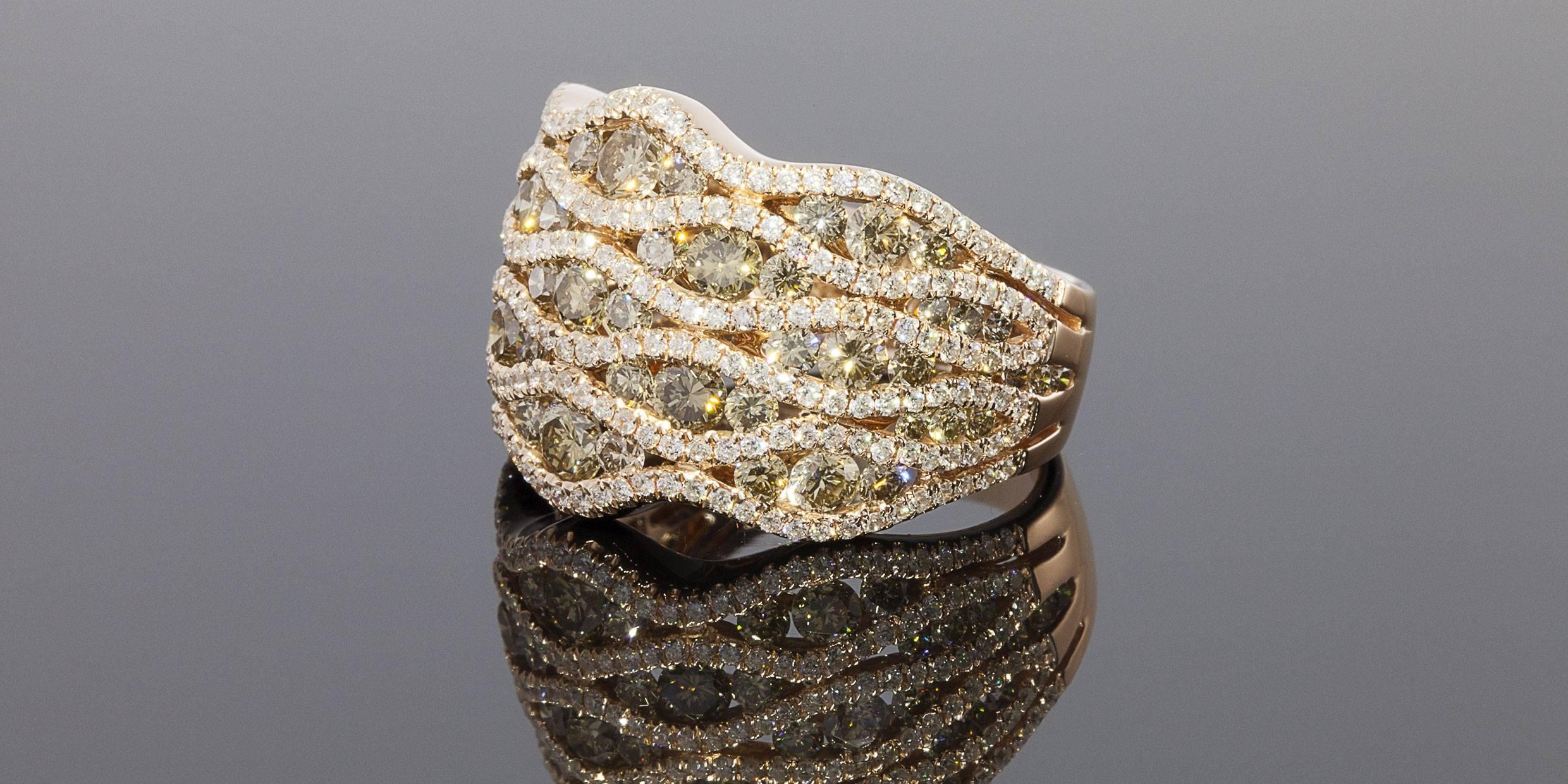 This gorgeous ring is simply breathtaking! It features 57 beautiful champagne-brown round diamonds & 234 sparkly white round diamonds. These diamonds have a combined total weight of 3.07 carats & are VS in clarity. The diamonds are prong & channel