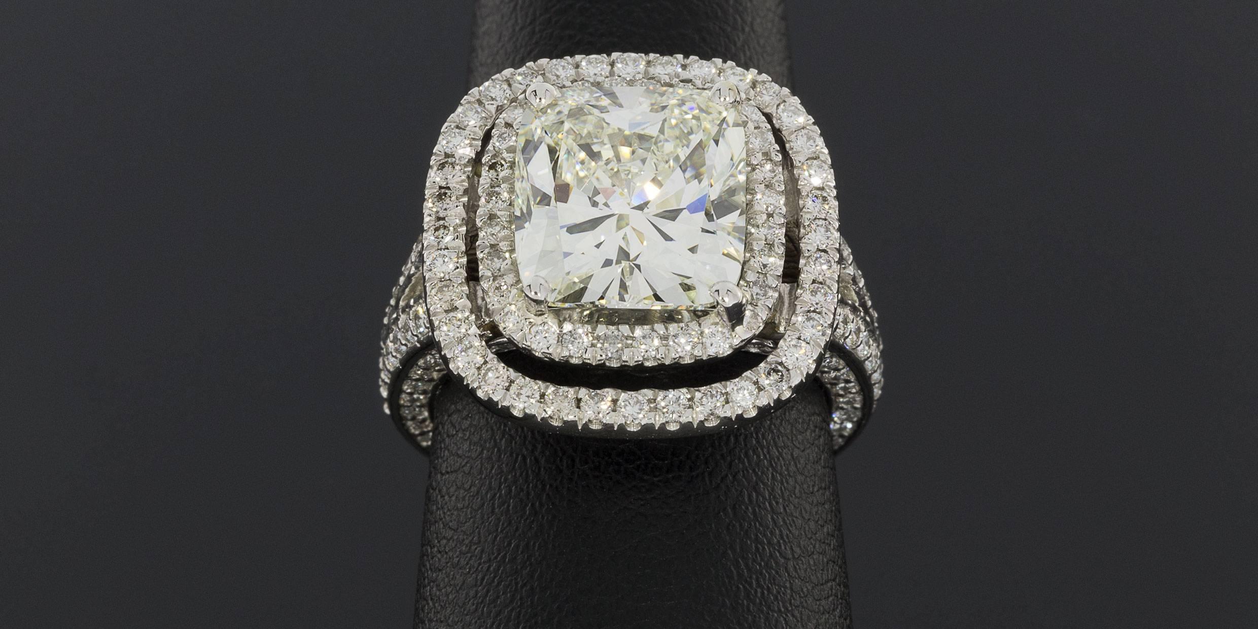 Spectacular Platinum 6.41 Carats Cushion Diamond GIA Cert Halo Engagement Ring In Excellent Condition For Sale In Columbia, MO