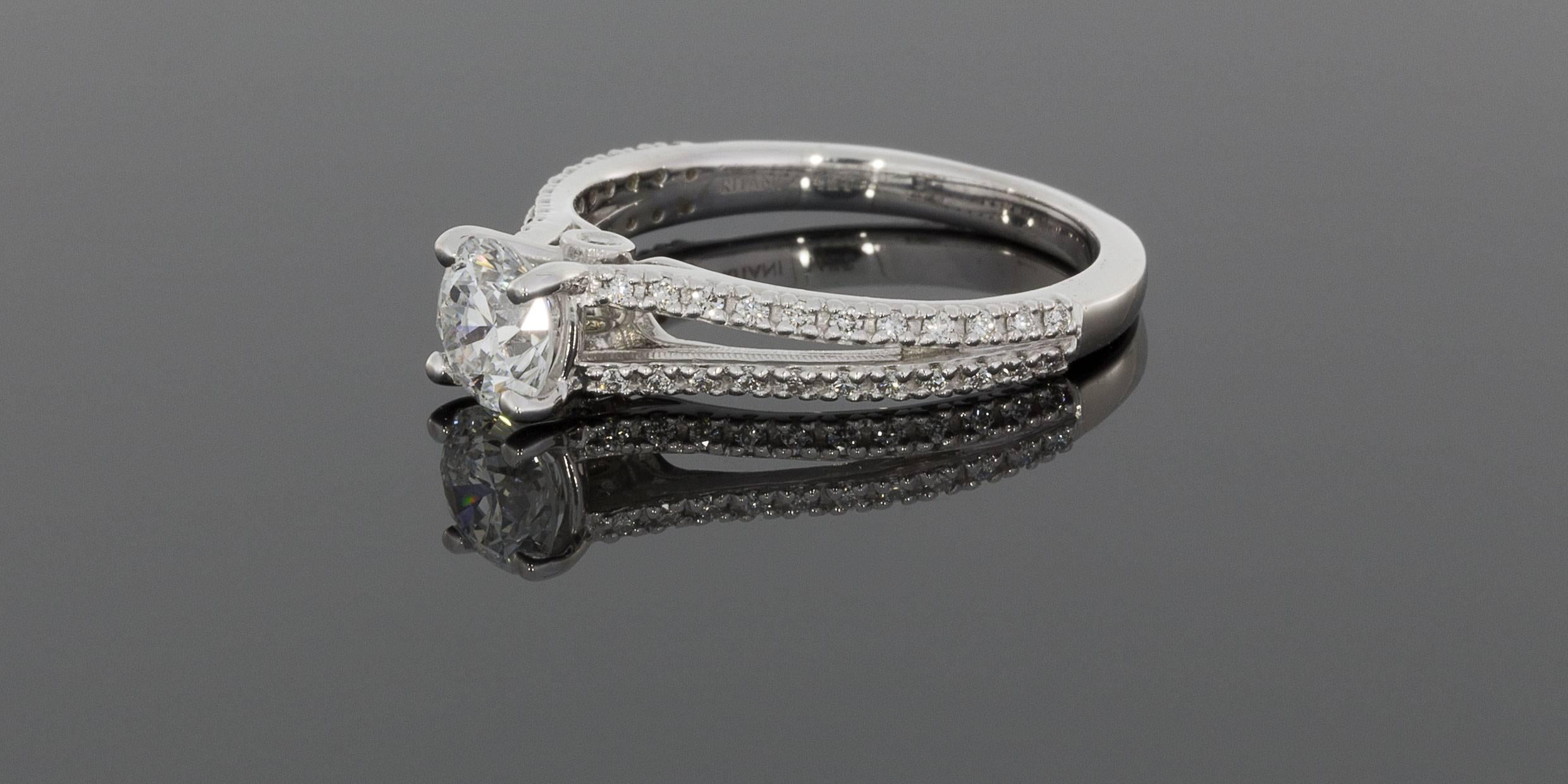 This beautiful diamond halo engagement ring is from the designer Ritani, one of the most recognized designers in the world. Ritani engagement rings feature the world's most beautiful diamonds & gemstones, hand selected by in-house, certified