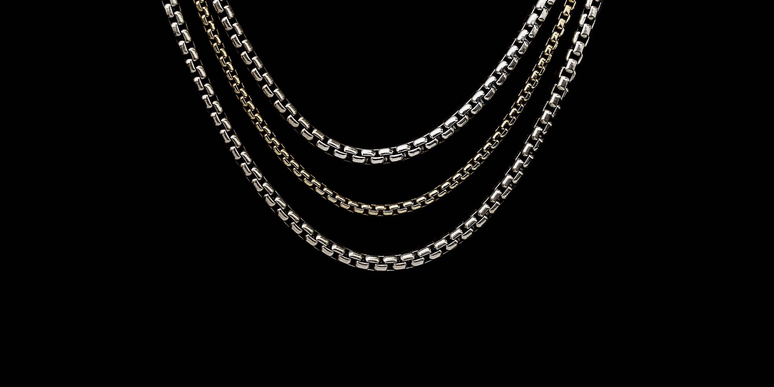 This beautiful multi-strand necklace from David Yurman, a legend in the jewelry business. he necklace features two sterling silver & one 18 karat yellow gold box chains. With multiple loops for the loop & toggle clasp, this necklace is adjustable
