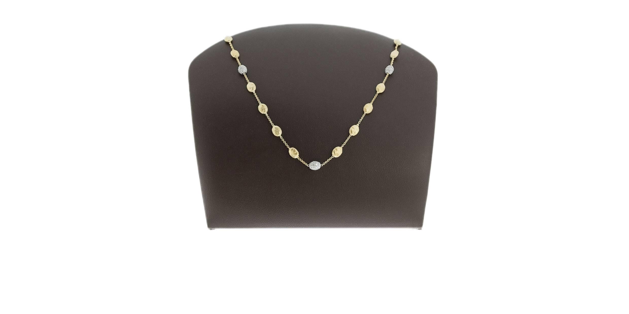 Add some drama to your wardrobe with this beautiful Marco Bicego necklace from the Siviglia collection. This station necklace is comprised of 18 karat yellow gold and features oval shapes that sport the textured finish of the Bulino technique.