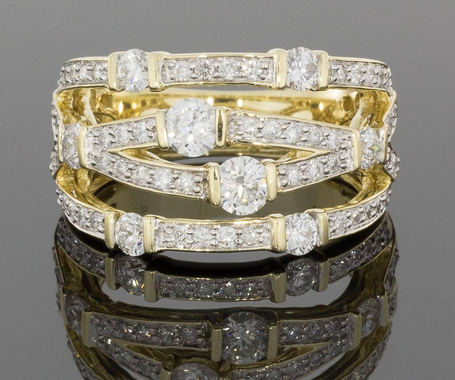 This unique band is a beautiful, wide 14 karat yellow gold diamond band that makes quite the sparkly statement! It can be used as a right hand ring or a non-traditional wedding ring. The ring features round brilliant cut diamonds that are bar &