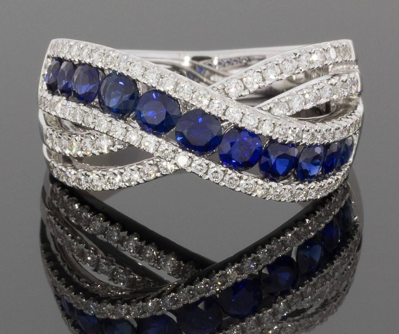This breathtaking ring features a 1.08 carats in natural, AAA quality, round cut, blue sapphires & .57 carats in sparkly, FG/VS quality, round brilliant cut diamonds. The combined total carat weight is 1.65 carats. This gorgeous sapphire &