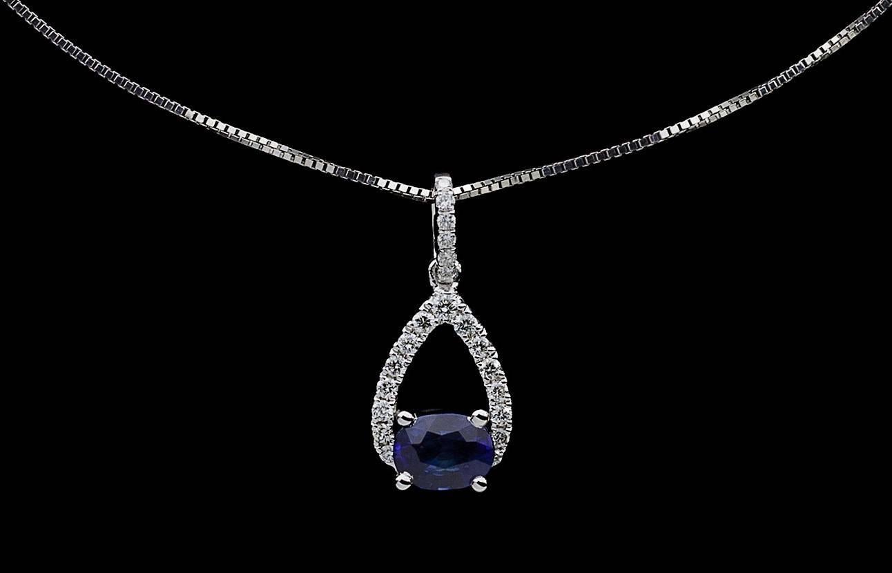 Simple yet elegant & beautiful would be the best way to describe this stunning necklace! It features a .45 carat, oval cut, natural, blue sapphire that is prong set oriented horizontally. The pendant also features sparkly, round brilliant cut