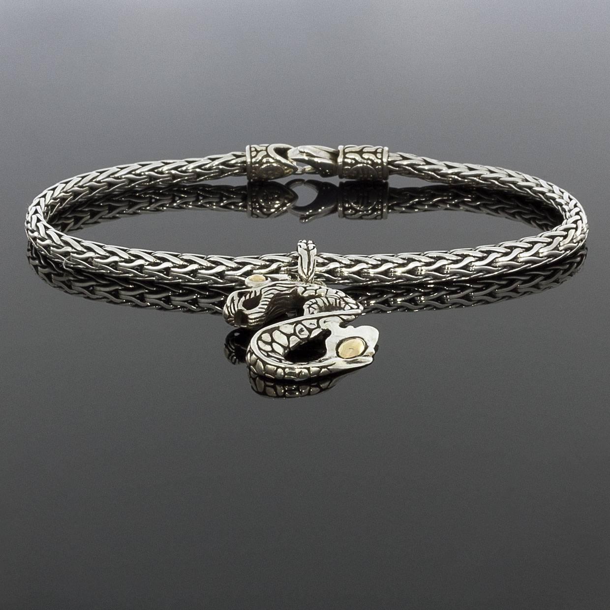 Each piece of John Hardy jewelry has been crafted in Bali since 1975. John Hardy is dedicated to creating timeless one-of-a-kind pieces that are brilliantly alive.

This sterling silver charm bracelet is from John Hardy's Naga Dragon collection. The
