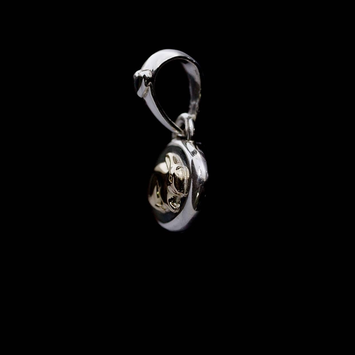 Each piece of John Hardy jewelry has been crafted in Bali since 1975. John Hardy is dedicated to creating timeless one-of-a-kind pieces that are brilliantly alive.

This sterling silver and yellow gold pendant is from John Hardy's Year of the Rabbit